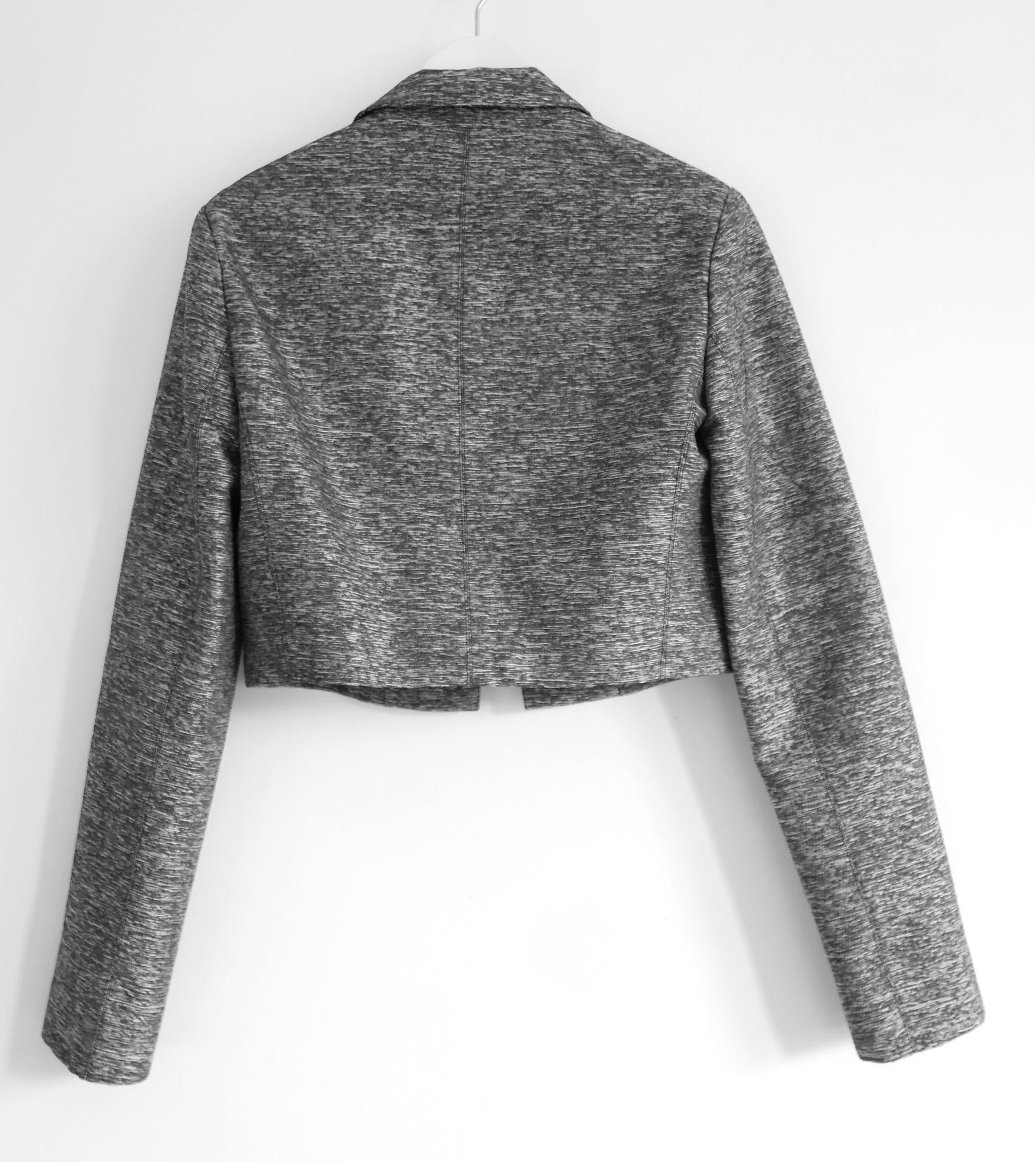 Sleek and chic Dior cropped jacket from Raf Simons’ Resort 2015 collection. Look 57 on the runway. Bought for around £2950 and unworn with tag/spare fastening. Made from lightly textured silvery grey marled viscose and silk with a black silk lining.