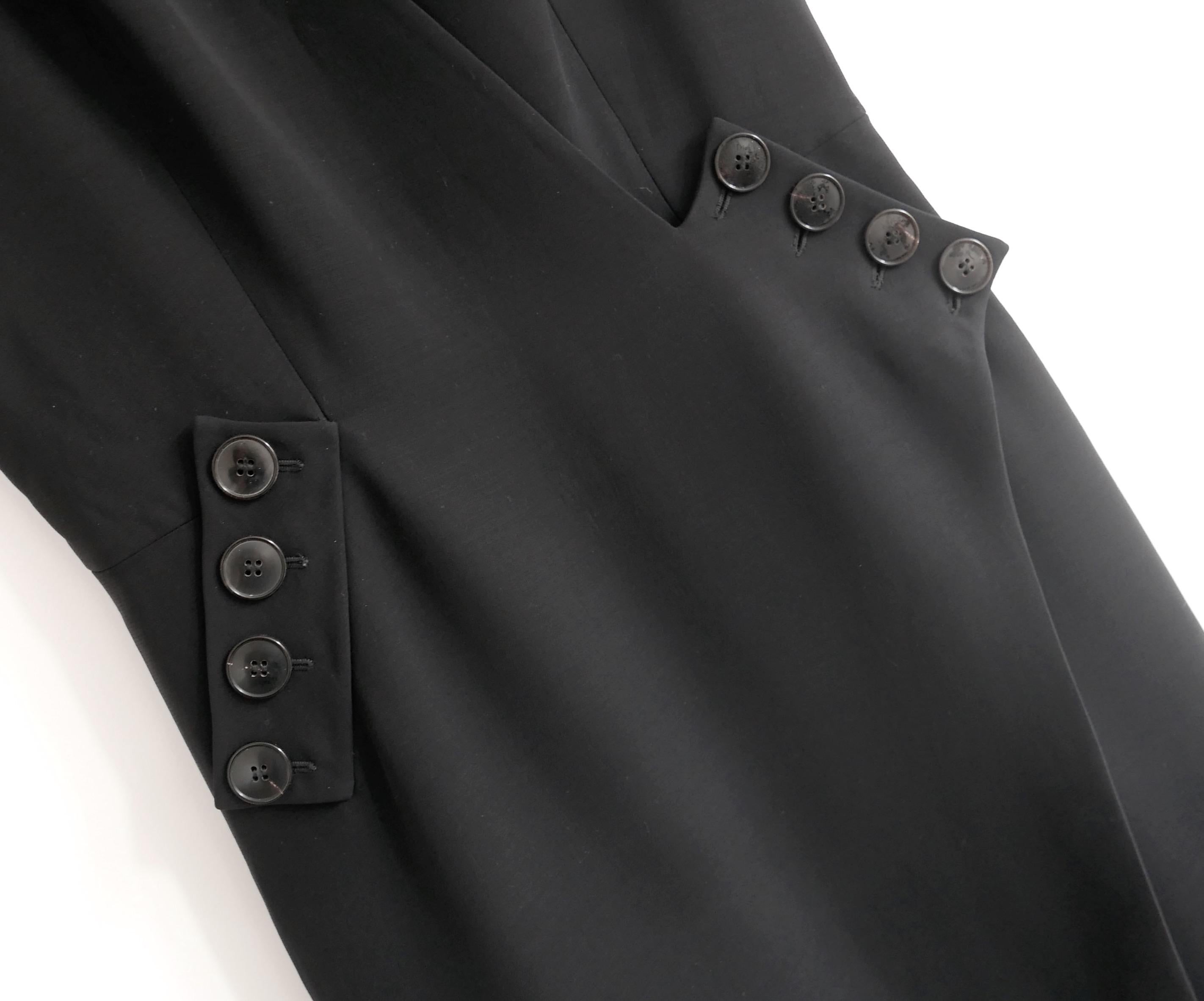 Absolutely stunning Dior black dress from Raf Simons’ Spring 2015 Collection - Look 27 on the runway. Original retail was $5000 and it is new with tag/spare button.  Made from smooth black silk and will mix, it is superbly tailored with Bar jacket