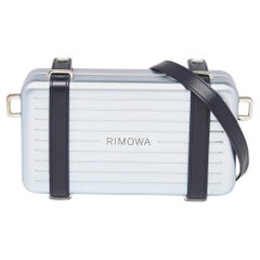 Dior x Rimowa Personal Clutch aus blauem Aluminium und Leder