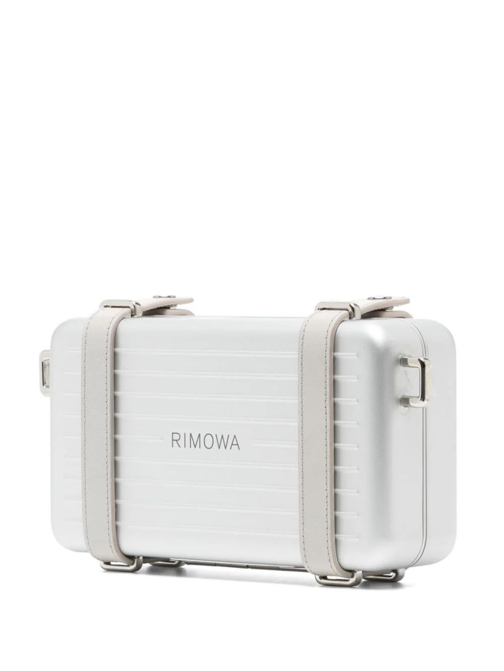 Expertly crafted and limited edition, the Dior x Rimowa Clutch is a statement piece that showcases a collaboration between two renowned brands. Made with the highest quality materials, this silver bag from the collection exudes luxury and style.