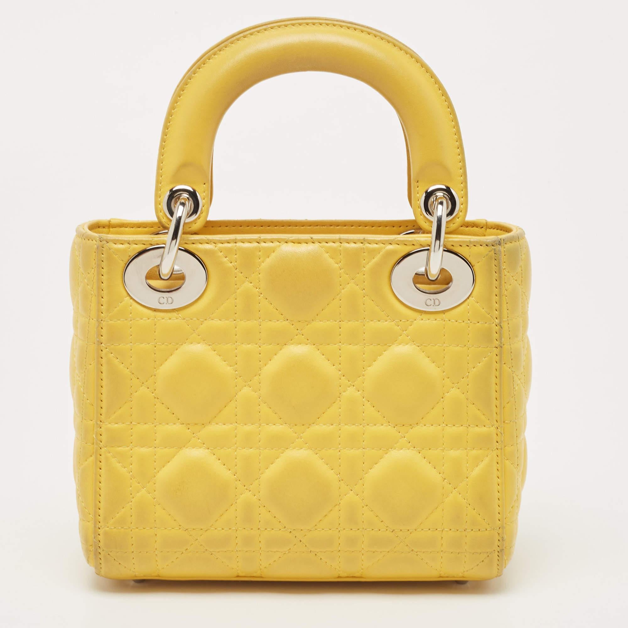 A timeless status and great design mark the Lady Dior tote. It is an iconic bag that people continue to invest in to this day. We have here this classic beauty crafted from yellow Cannage leather. The bag has a lined interior for your essentials.