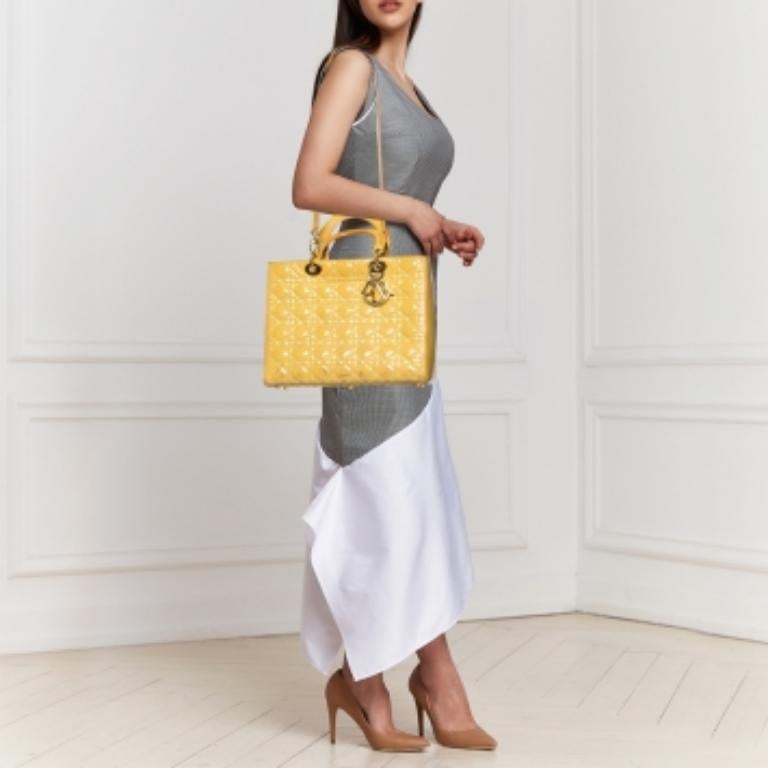 The Lady Dior tote is a Dior creation that has gained recognition worldwide and is today a coveted bag that every fashionista craves to possess. This tote has been crafted from patent leather and it carries the signature Cannage quilt. It is