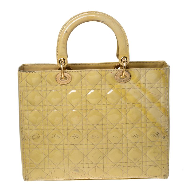 The Lady Dior tote is a Dior creation that has gained recognition worldwide and is today a coveted bag that every fashionista craves to possess. This yellow tote has been crafted from patent leather and it carries the signature Cannage quilt. It is