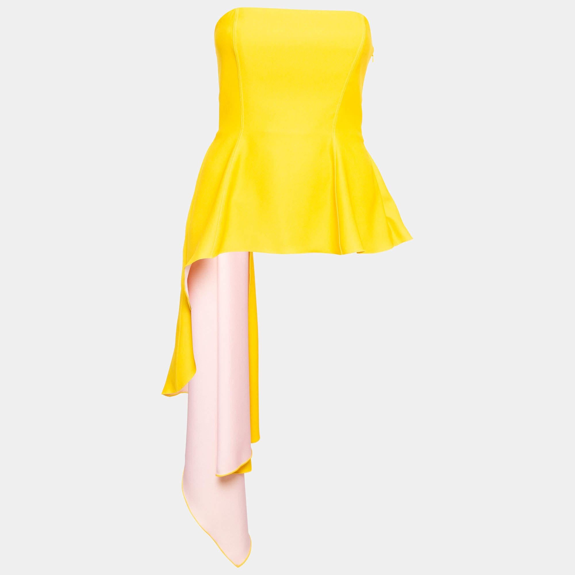 Introducing the Dior top, a vibrant marvel of fashion. Crafted with meticulous attention to detail, it exudes an effortless charm. Its strapless design and asymmetric silhouette offer a modern twist, while the corset element accentuates curves with