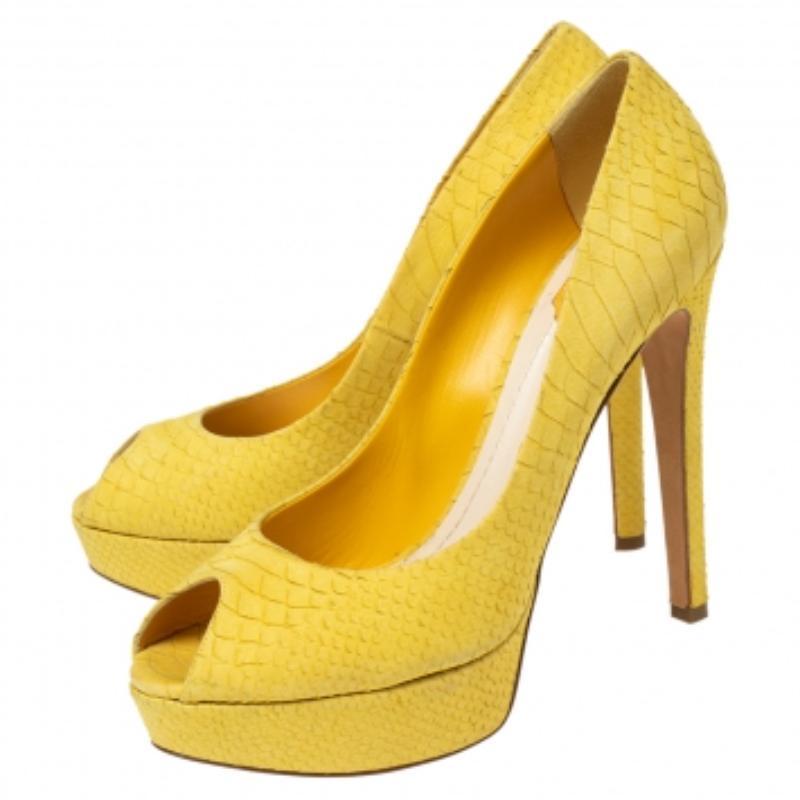 The Miss Dior collection from Dior is a significant creation that continues to attract everyone with its impeccable style. These Miss Dior pumps are created from python-embossed leather and feature peep-toes, platforms, and high heels. Step out
