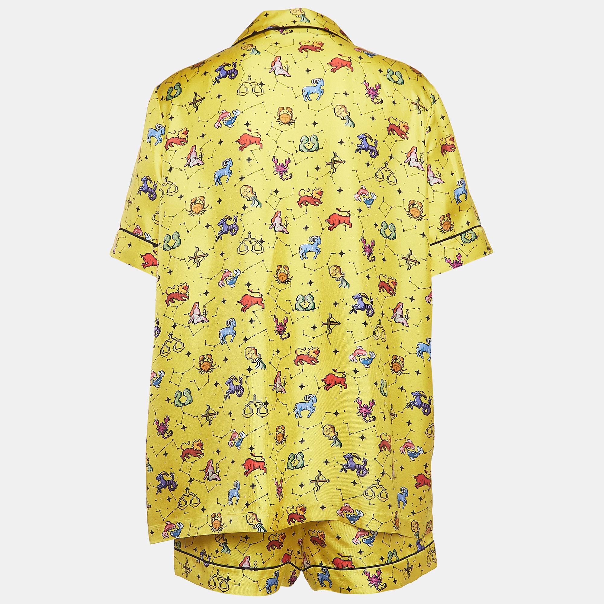 In vibrant hues of yellow, the Dior shirt and shorts Set exudes celestial charm. Crafted from luxurious silk, the shirt features a striking zodiac print, while the coordinating shorts offer comfort and style. Perfect for those seeking