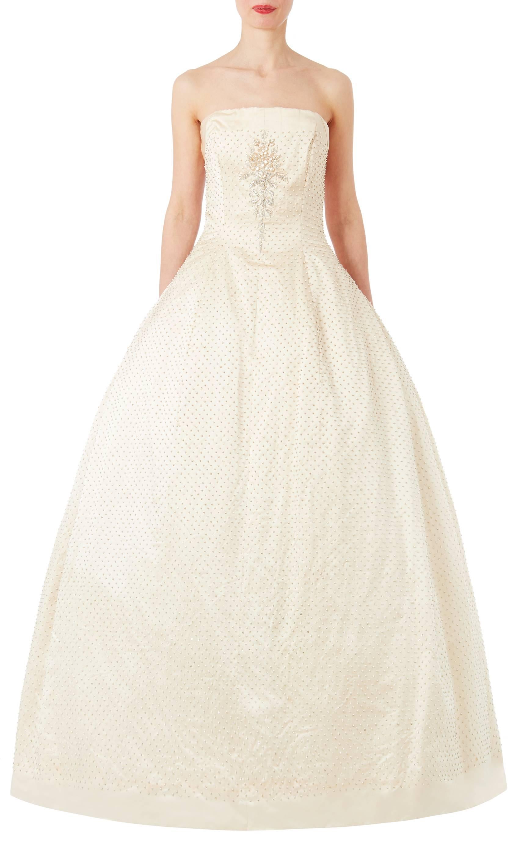 Christian Dior designed under his own name for only a decade, but his influence is everlasting. Here is a very rare opportunity to own a breathtaking Haute Couture 