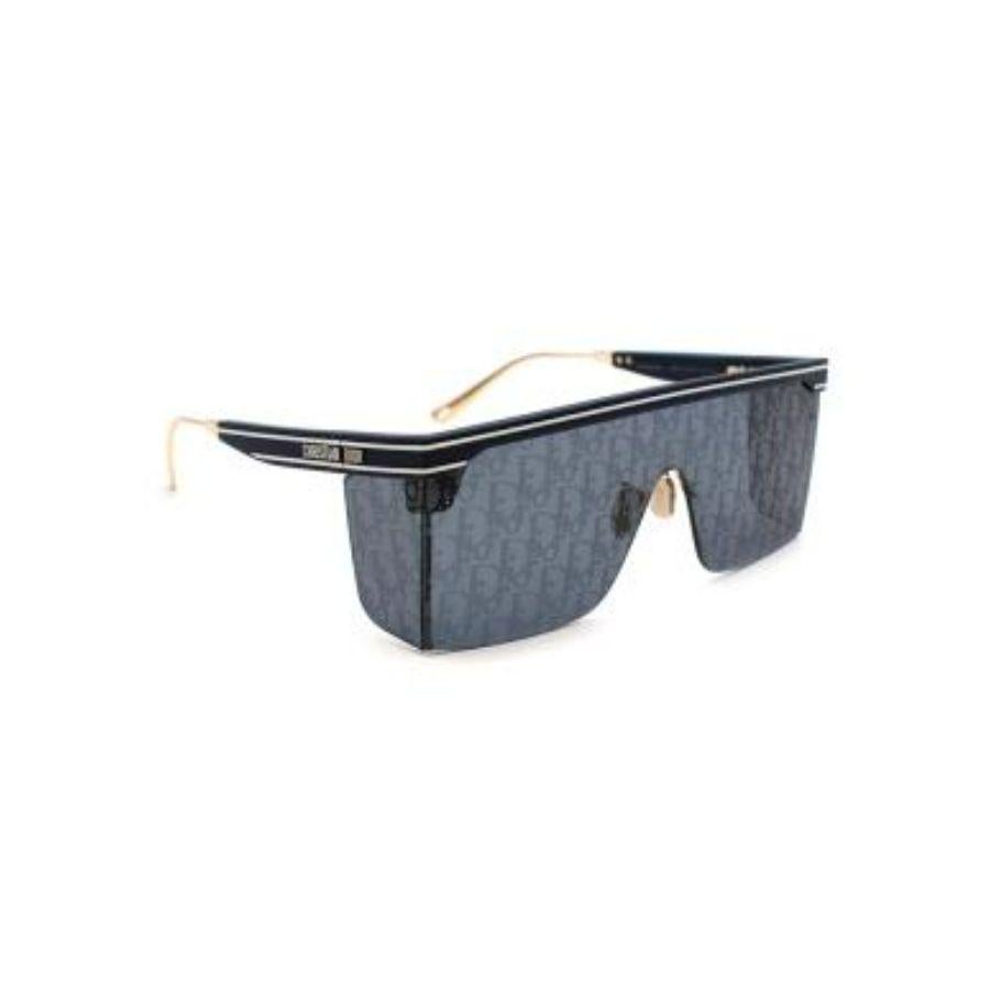 Dior So Real Logo Print Tinted Lens Blue Aviator Sunglasses
 

 - Blue stripe logo acetate body
 - Oversized aviator lenses with Dior logo print 
 - Gold tone arms 
 - Rectangular shape 
 

 Materials:
 Acetate 
 

 Made in Italy 
 

 PLEASE NOTE,