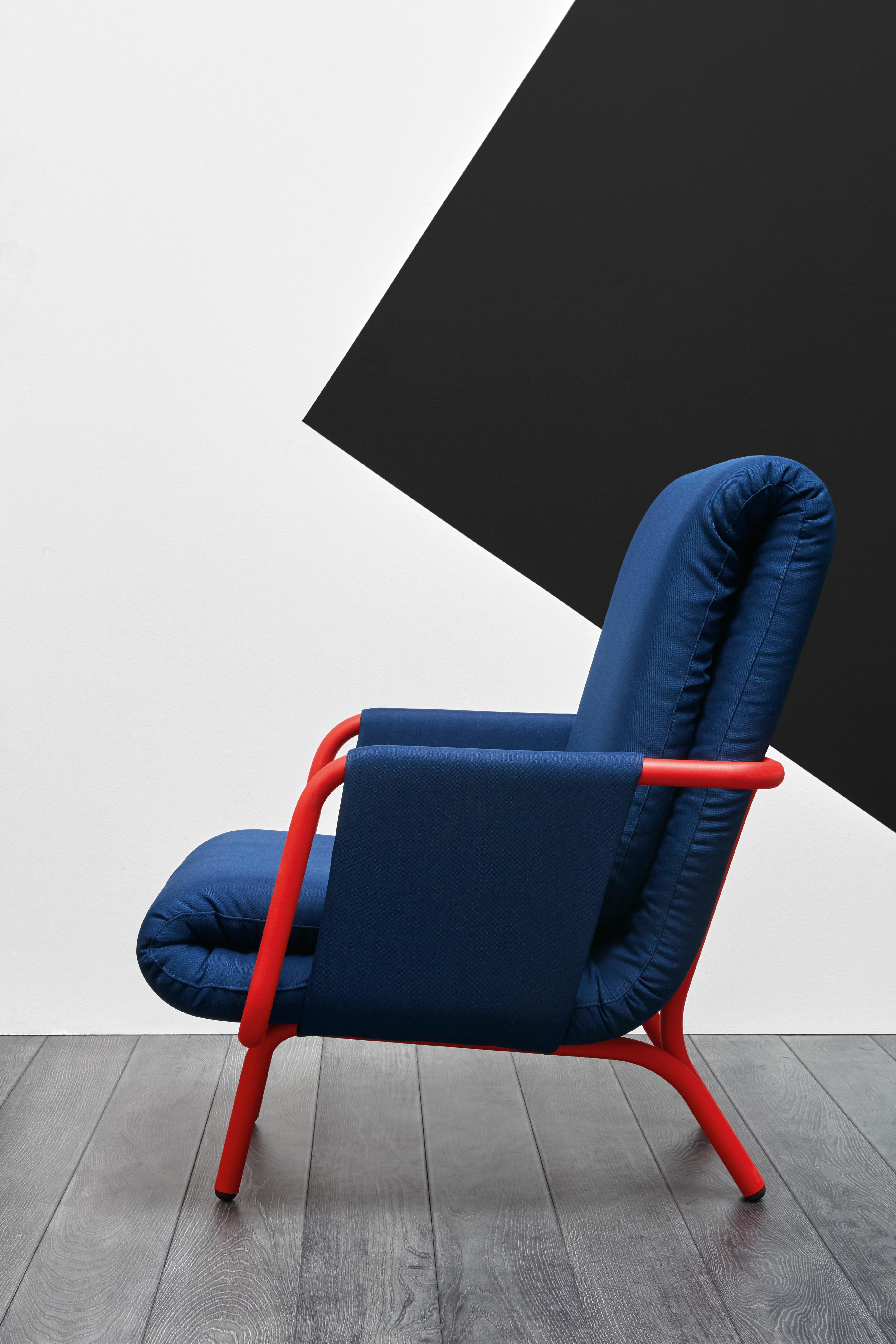 Here you are shown the Diplopia armchair with the Lacquered Red Marsala metal frame and upholstery. The armchair is available for custom orders with a metal frame lacquered in white, silk grey, dusty grey, black or intense blue. The double folded