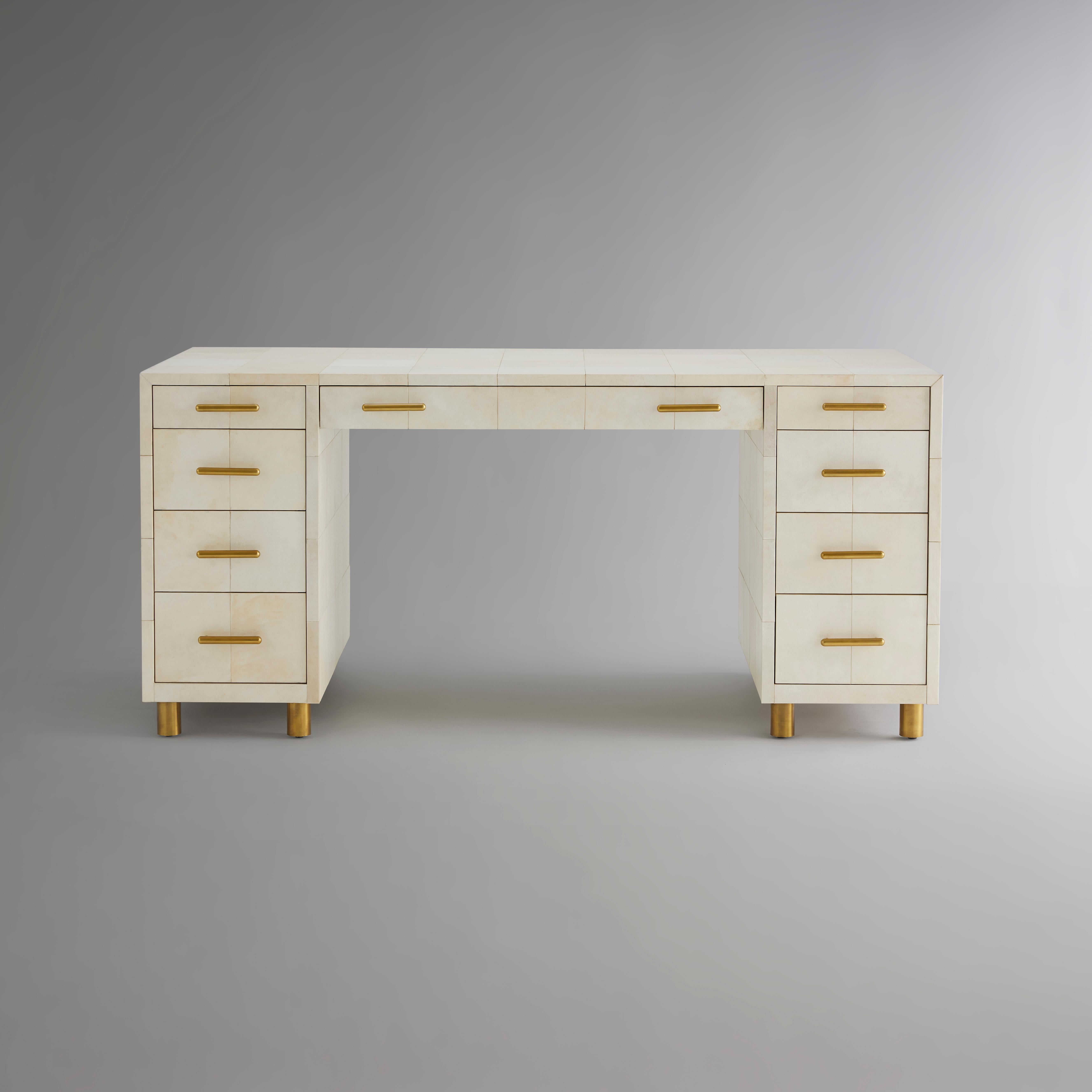 With chic refinement suitable for the finest library, the desk is covered with ivory vellum. The small hides are uniformly joined in four-inch panels and tailored to perfectly align the seams. The hand of this exquisite material elevates the desk,