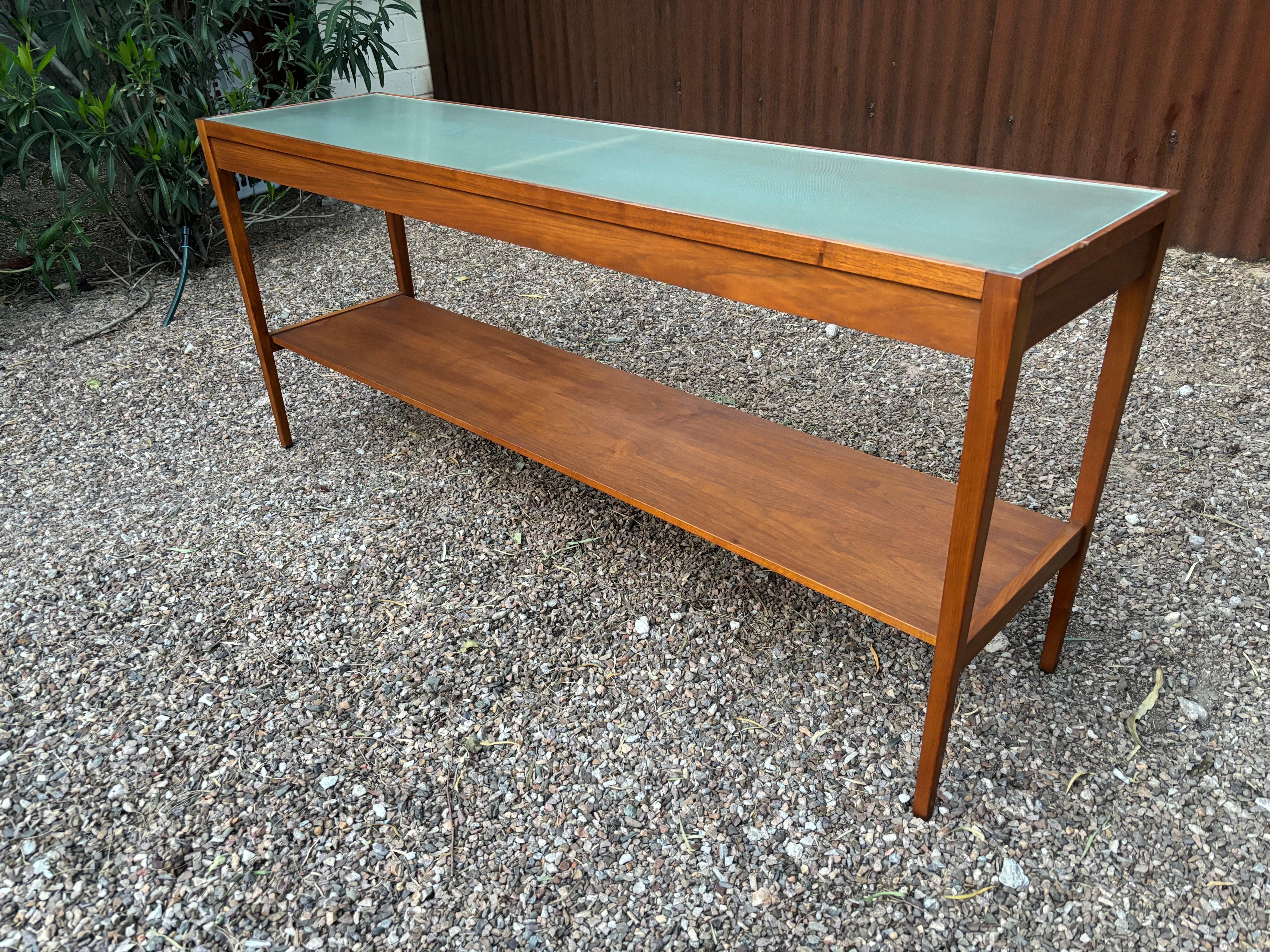 Directional Walnut and Glass Console or Entrance Table attributed to Milo Baughman or Paul McCobb.  Probably originally had a stone or white glass top.  Retains Directional label that looks like mid 60's.  Great Scale and size, bonus bottom shelf! 