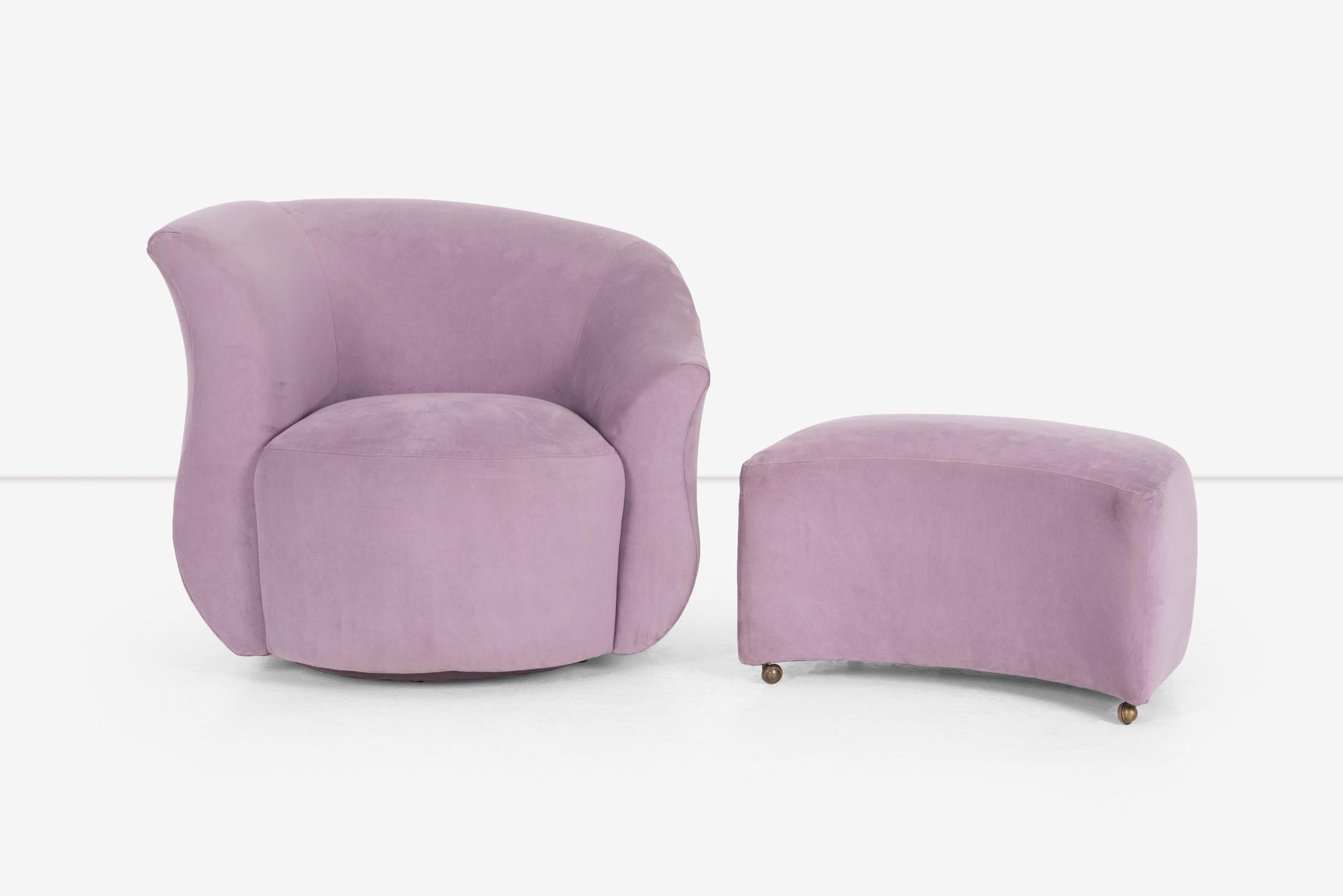 Asymmetric swivel set Lounge chair and ottoman on casters. Upholstered in a light purple ultra suede. Sound structural condition. Minor signs of scuffs and scrapes.

Dimensions
H: 31.5