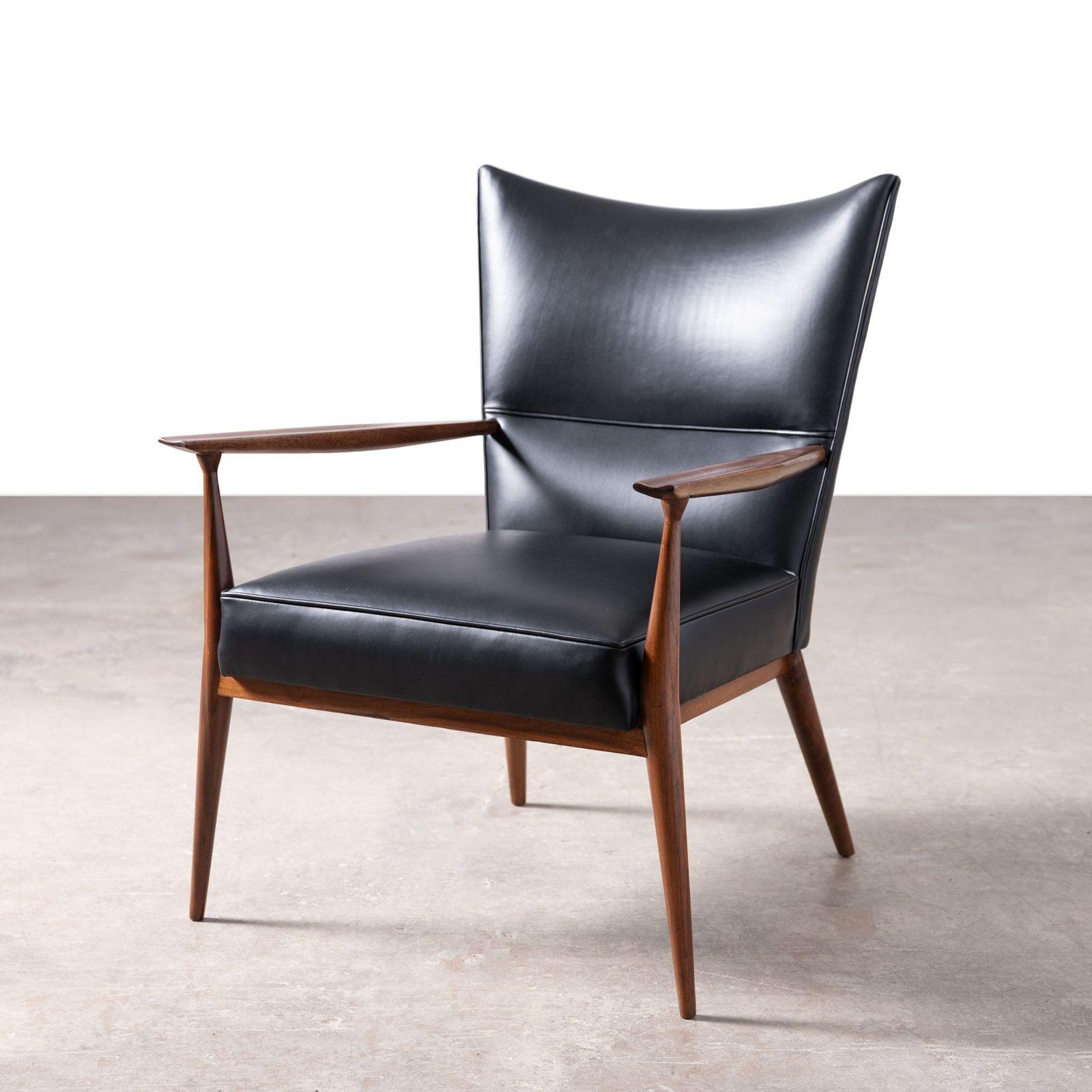 Rair set of Directional lounge chairs designed by Paul McCobb, 1955 for Custom Craft Inc. Both chairs are in excellent condition constructed in walnut with a new Bison hide upholstery. Paul McCobb stands out as one of America's most influential