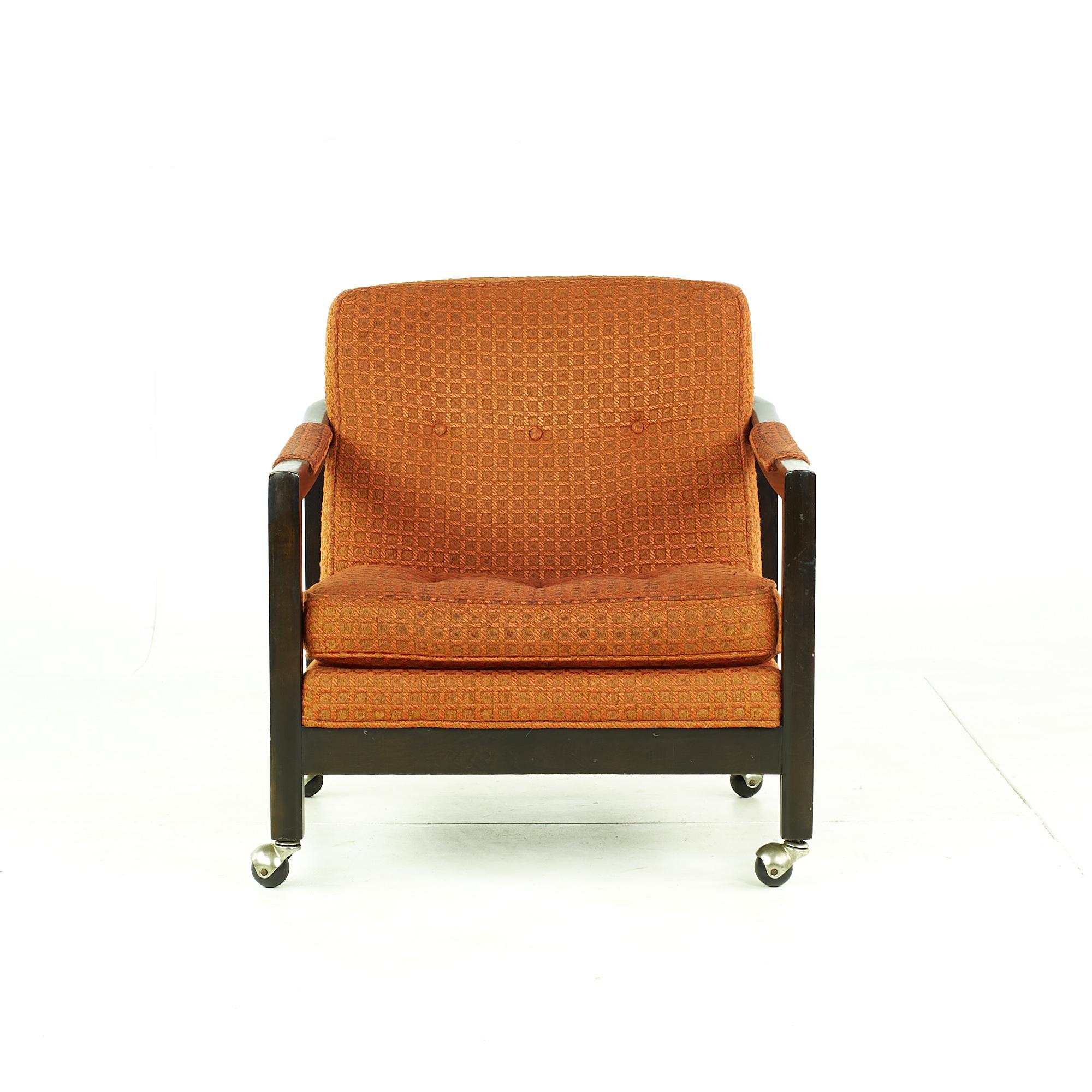 Directional mid century lounge chair with casters.

These chairs measure: 26 wide x 34 deep x 29 inches high, with a seat height of 15 and arm height/chair clearance of 21.5 inches

All pieces of furniture can be had in what we call restored