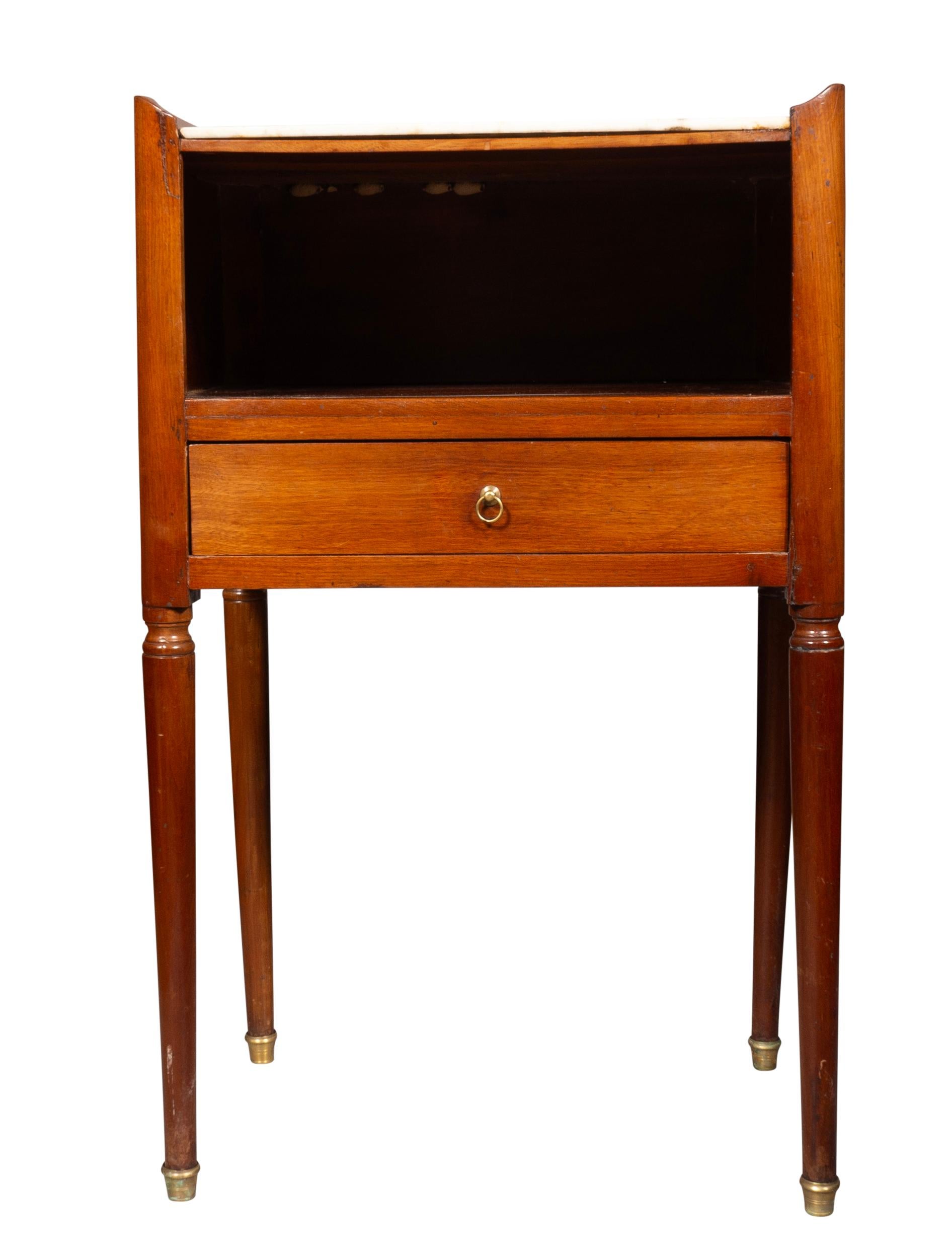 Rectangular with white marble top over a compartment and drawer and with turned tapered legs.