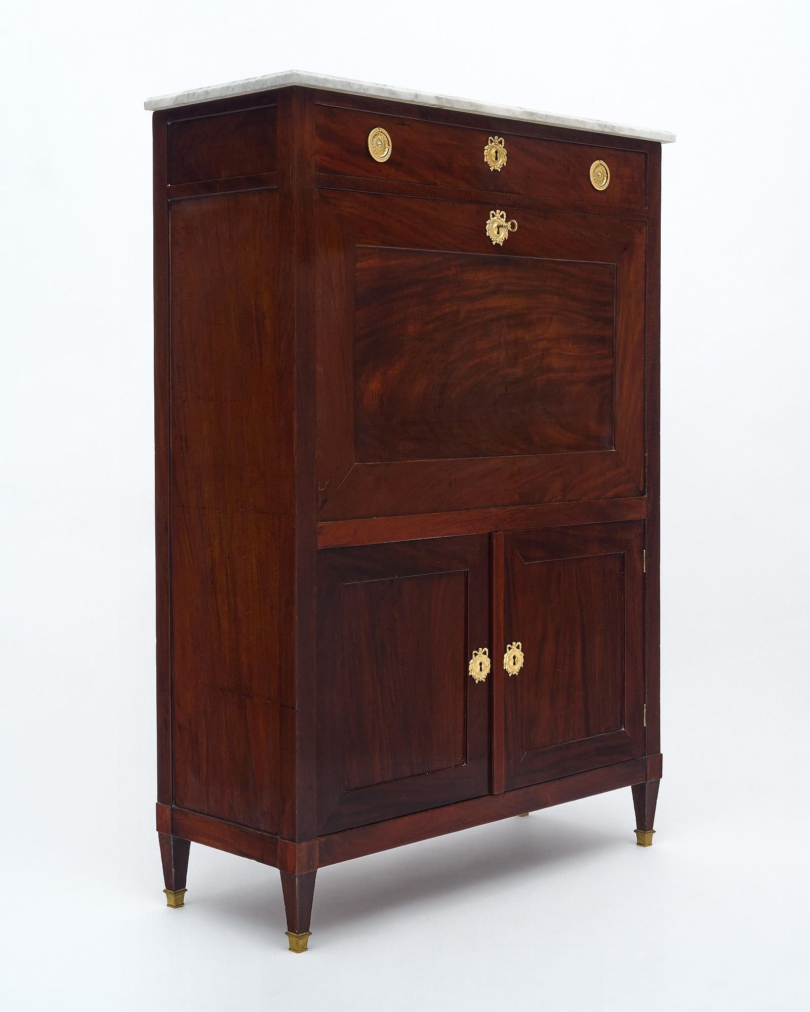 Secretary from France from the Directoire period. This piece is made of solid hand 