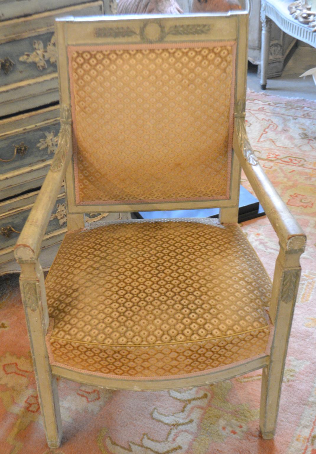 18th century, Directoire polychrome fauteuil
rectangular back surmounted by a foliate wreath-carved crest, joined by rounded arms to the padded set, raised on paneled square legs, upholstered in cut velvet. Measures: Seat height 16