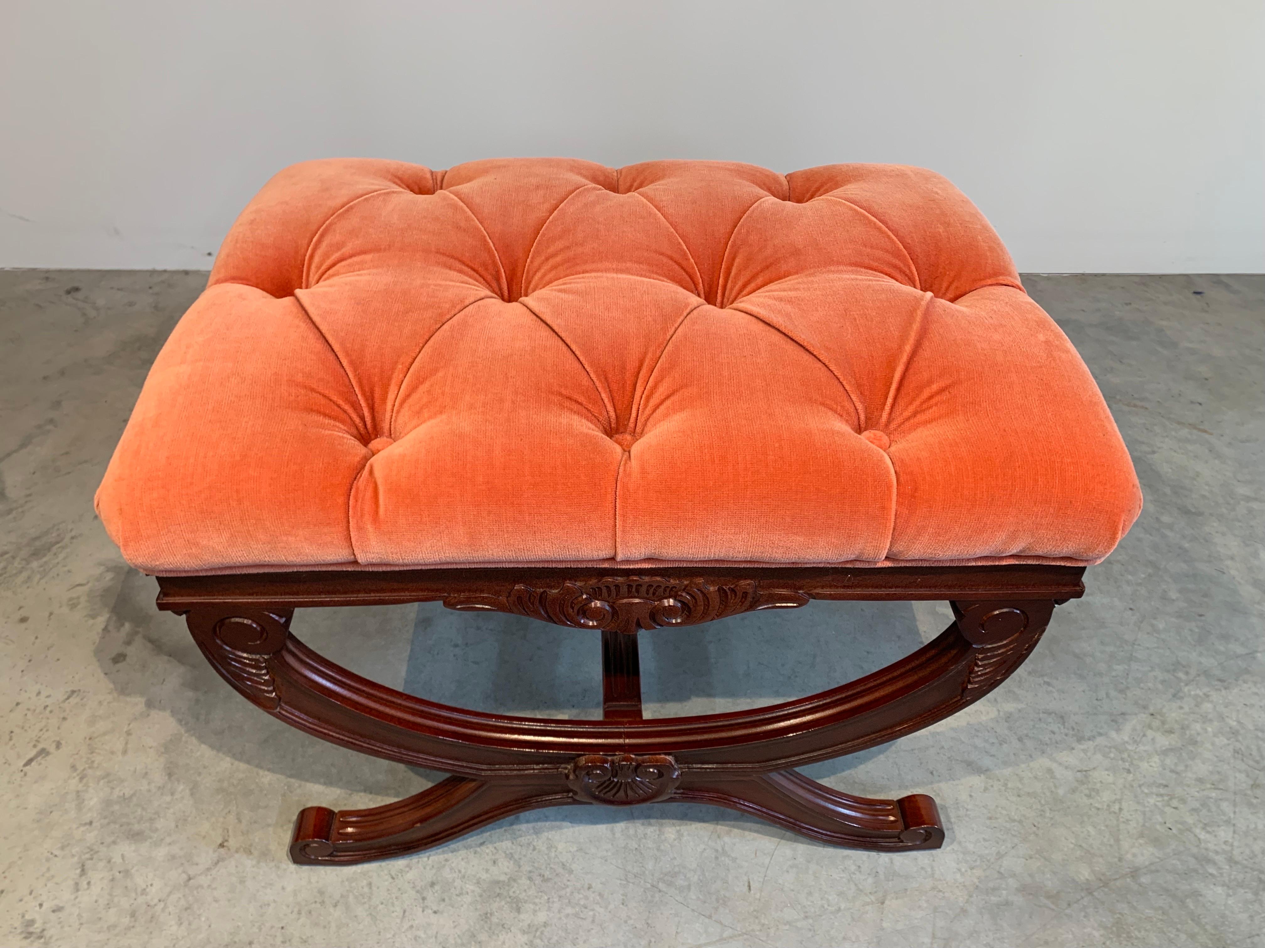An elegant tufted ottoman in Directoire French regency style having X-base mahogany frame. 
 Can be used as a bench as well. 
 In excellent condition.