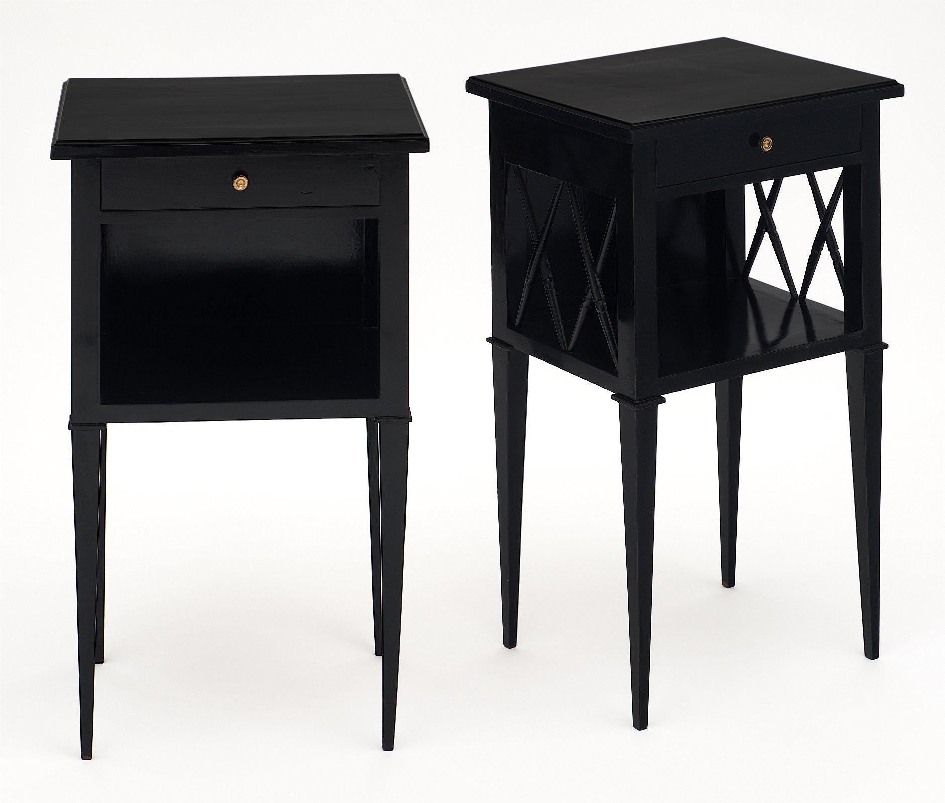 Antique Directoire style ebonized side tables each with one dovetailed drawer. The solid cherrywood construction has been ebonized and finished with a lustrous French polish. The sides are detailed with stylized bamboo stretchers. We love the