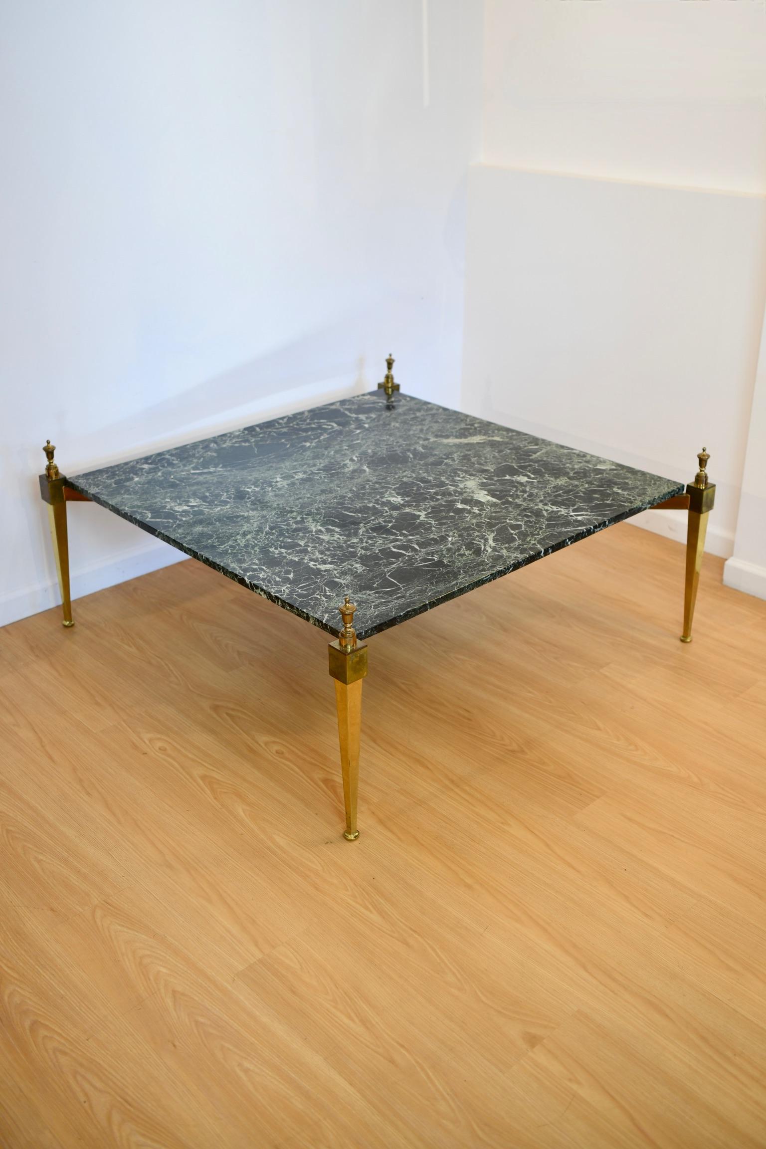Directoire-style green marble top coffee table on brass legs, circa 1950. Dimensions: 20.5