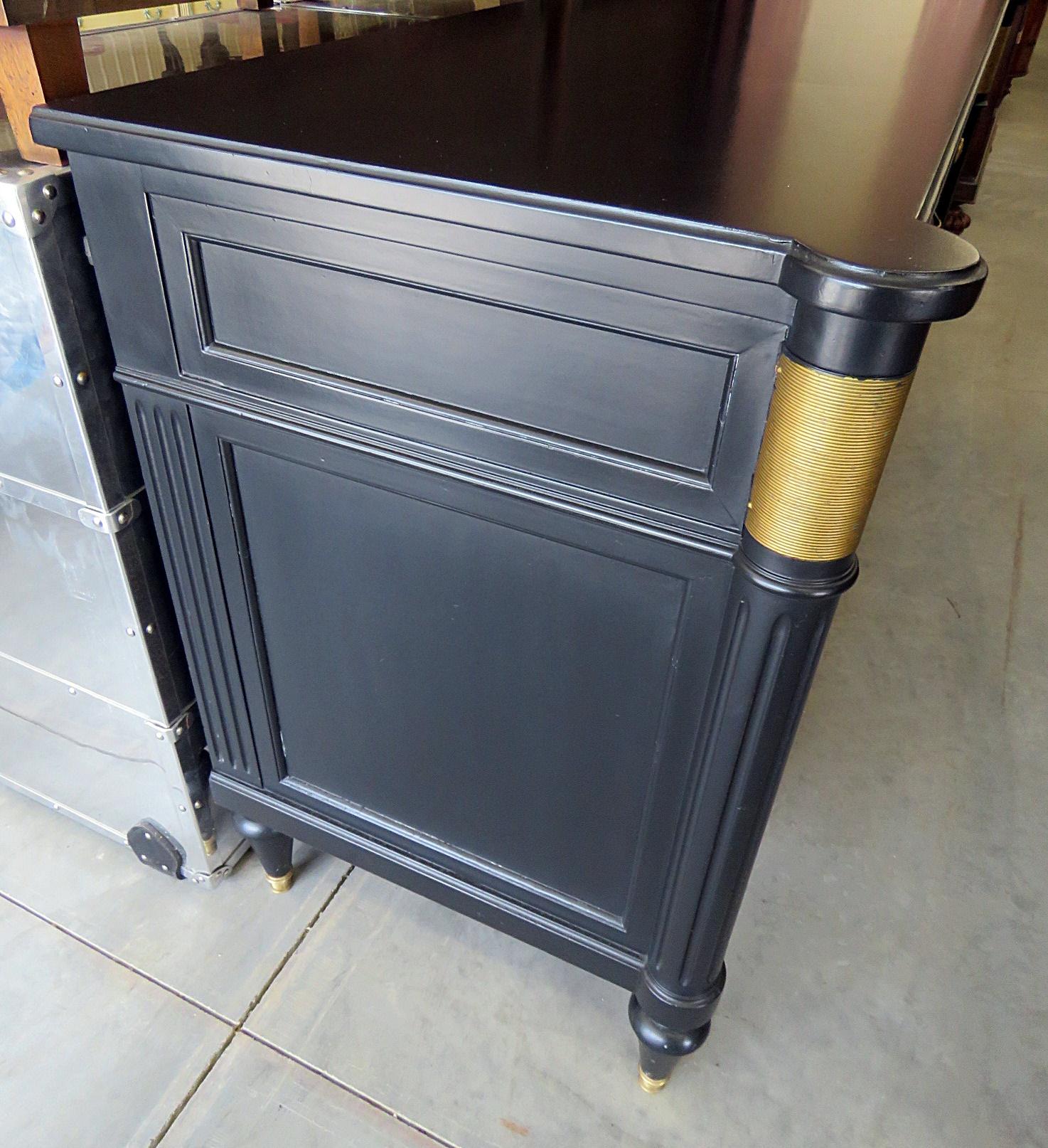 Directoire style ebonized 9-drawer commode with bronze accents.