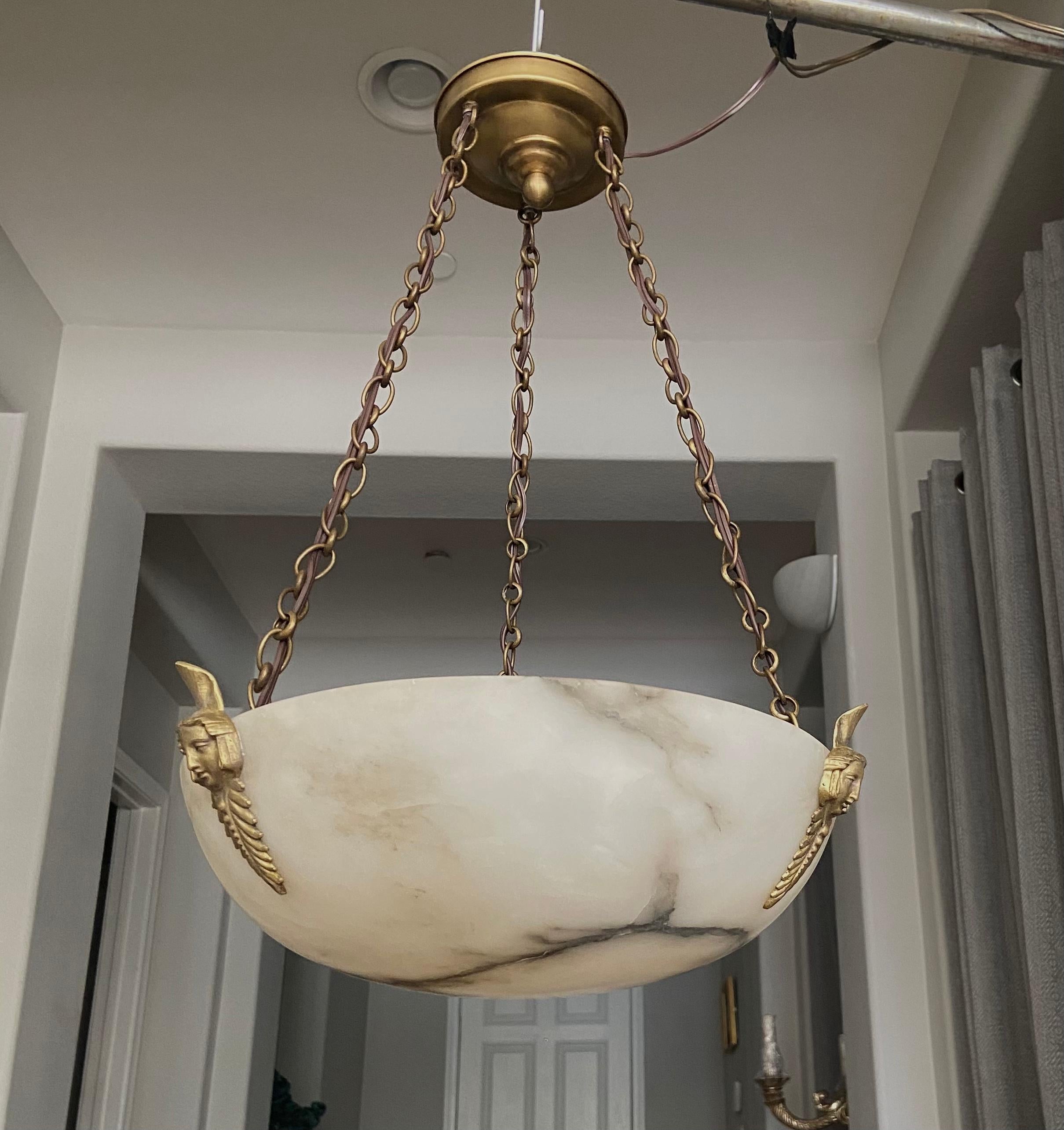 French 1930s alabaster pendant light or chandelier with brass fittings in the Directoire style. Beautiful natural veining to alabaster and quality fittings. Newly wired for US, fixture uses three candelabra or 