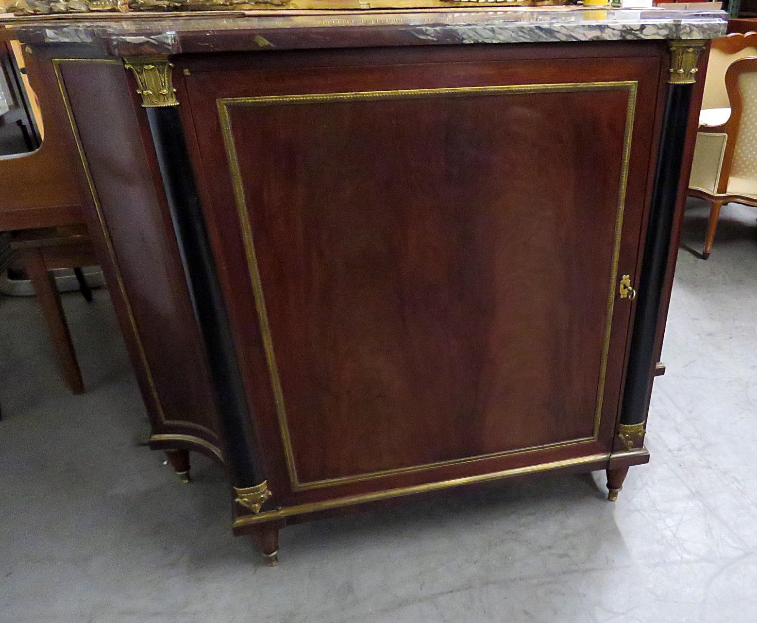 This is a superb bronze mounted flame mahogany Directoire style marble top cabinet, attributed to Forest. The cabinet can be used as a buffet, a commode or as a piece simply to display a centerpiece or even used as a console table would be used. 