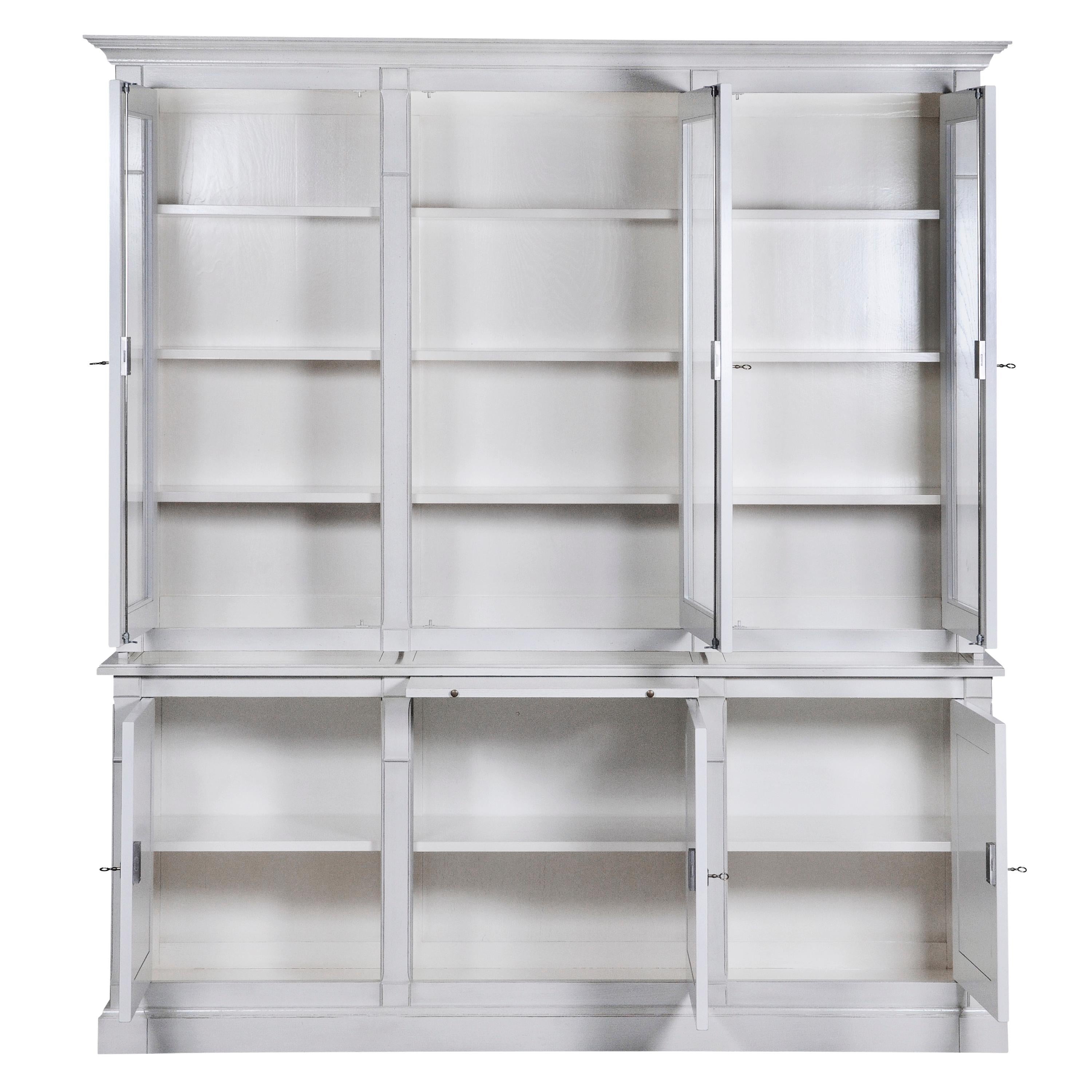 This 3 doors bookcase is a handmade reproduction of the French Directoire Style at the end of the 18th century.
This period style is remarkable with its straight, classical and timeless lines.

This piece of furniture It is made with 2 Parts. The