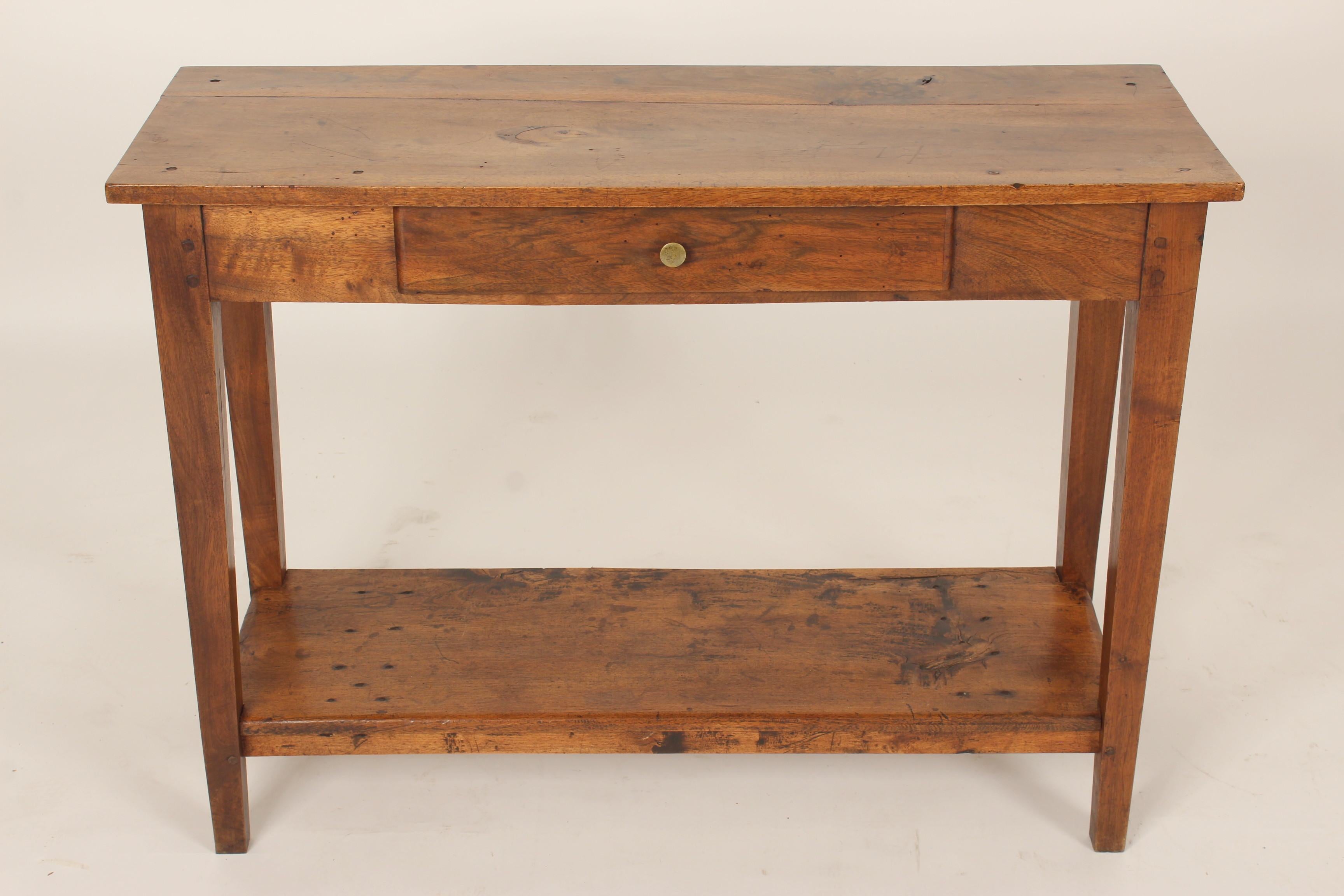 Directoire style walnut console table, 19th century with alterations. This table has color / patina. Table was originally deeper, bottom shelf is 20th century.