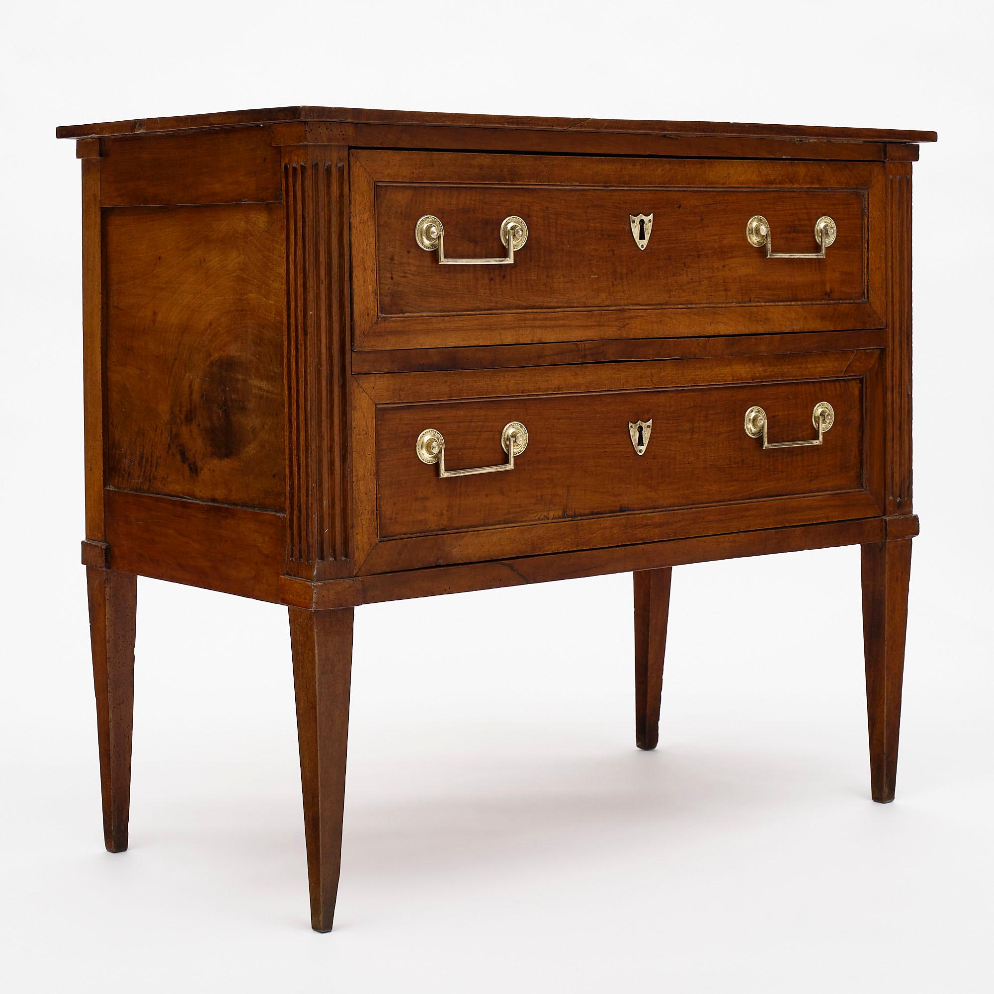 Chest of drawers or “commode sauteuse” from the French Directoire era made of solid walnut. We purchased this superb piece in the Rhône Valley. Two dovetailed drawers have oak as a secondary wood. The legs are square and tapered. We love the hand