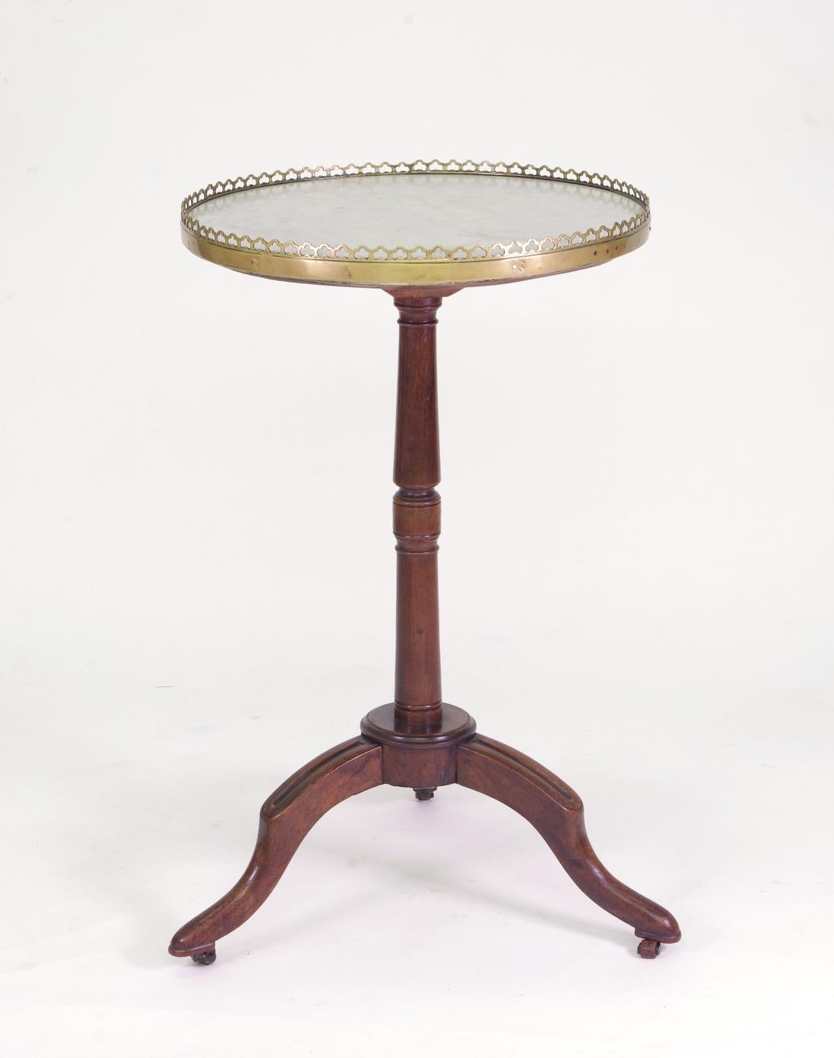 Directoire walnut guéridon or side table, the white marble top with a pierced brass gallery; the turned post supported by three cabriole legs with carved knees. Stamped J P Dusautoy (see photo).

Jean-Pierre Dusautoy was born in 1751 and received