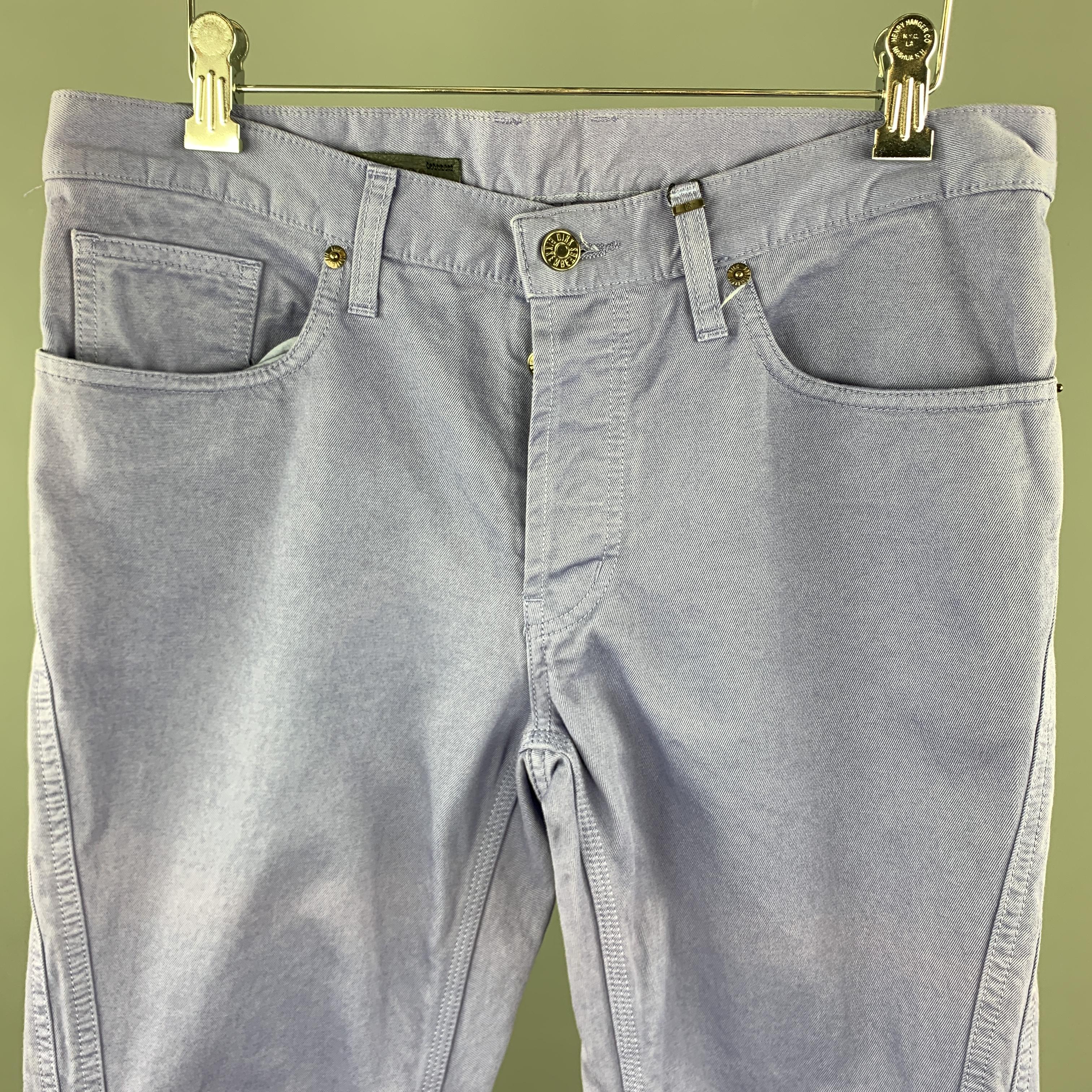 DIRK BIKKEMBERGS jeans come in light purple denim with a button fly double side seams, and silver tone back plaque. Made in Italy.

New with Tags.
Marked: 30

Measurements:

Waist: 33 in.
Rise: 9 in.
Inseam: 28 in.