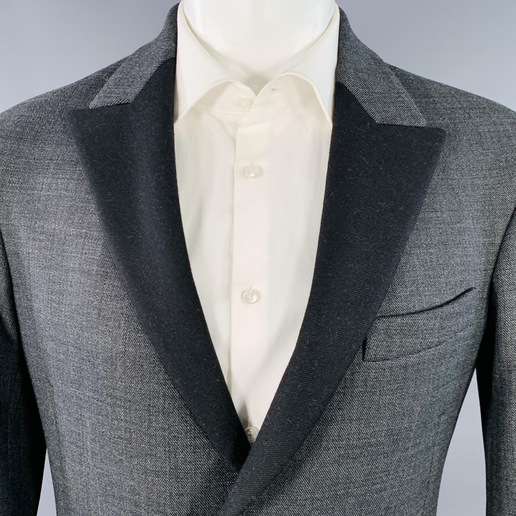 DIRK BIKKEMBERGS sport coat
in a grey polyester wool blend fabric featuring a contrasting black grosgrain peak lapel, ventless back, and single button closure. Made in Italy.New with Tags. 

Marked:   IT 46 

Measurements: 
 
Shoulder: 18.5 inches