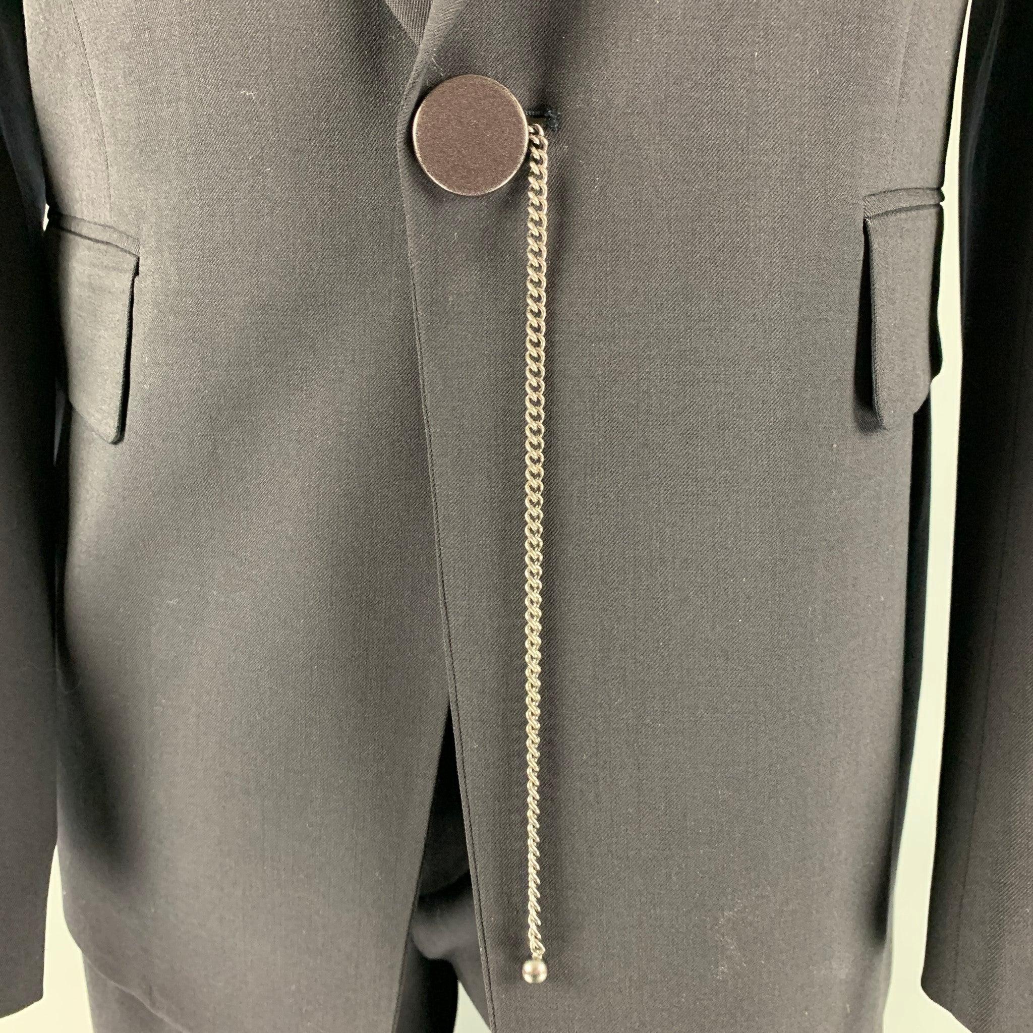 DIRK BIKKEMBERGS suit comes in a black wool woven material with a full liner and includes a single breasted sport coat with notch lapel and matching flat front trousers. Made in Italy.Very Good Pre-Owned Condition. 

Marked:   50 

Measurements: 
 