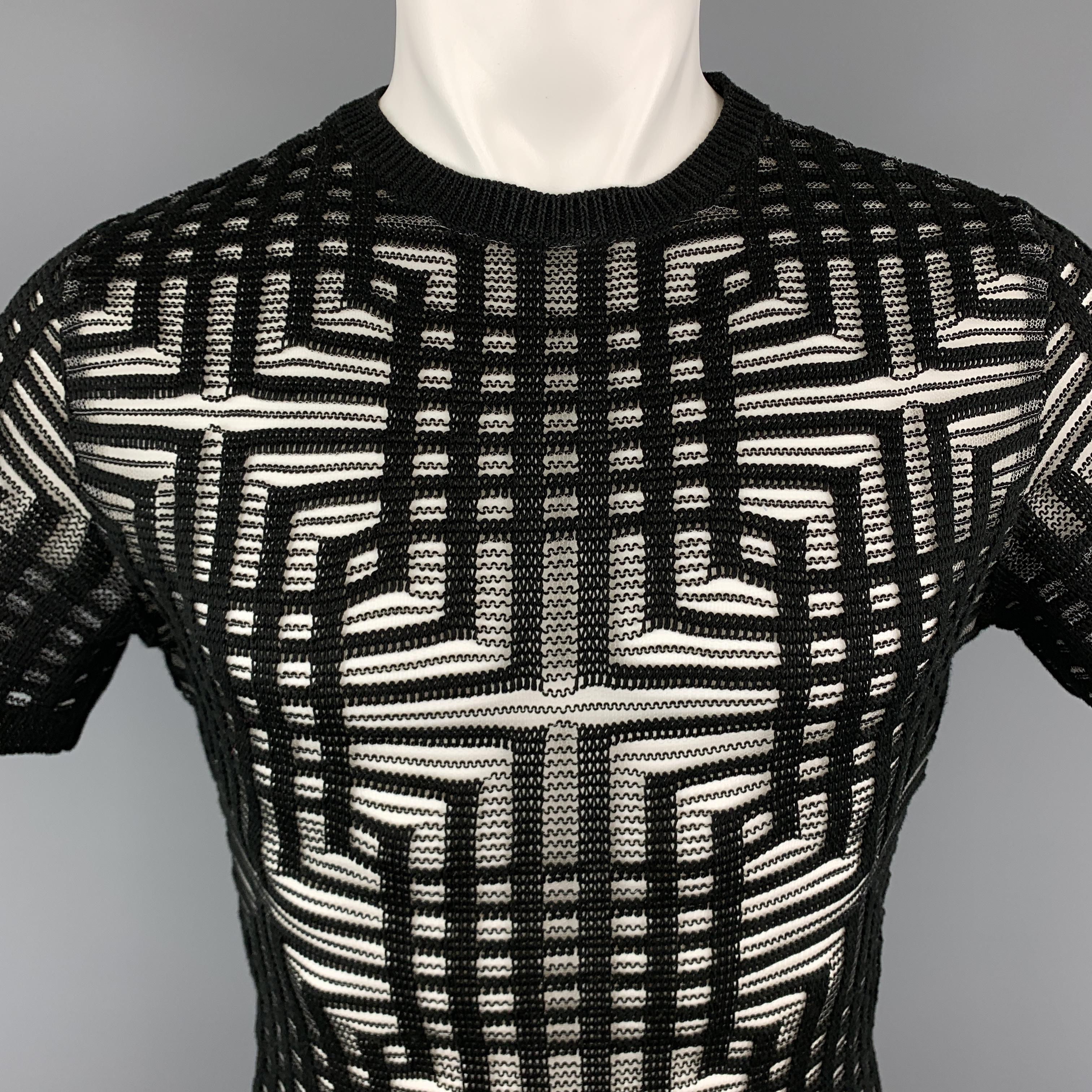 DIRK BIKKEMBERGS pullover comes in black knit with silver stripe geometric see through pattern throughout an short sleeves. 

Excellent Pre-Owned Condition.
Marked: (no size)

Measurements:

Shoulder: 16 in.
Chest: 36 in.
Sleeve: 9 in.
Length: 27.5