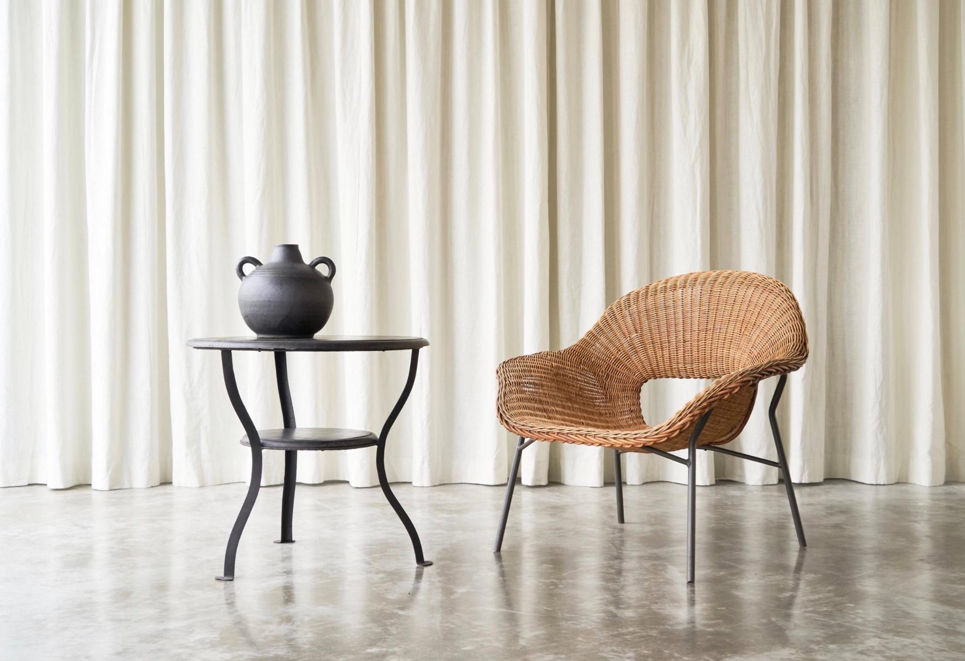Dirk van Sliedregt Easy Chair in Rattan and Metal, The Netherlands, 1960s.

This rattan and metal lounge chair was designed in the 1960s by Dirk Van Sliedregt, for Dutch manufacterer Gebroeders Jonkers. It is a rare model, as it was only made in a