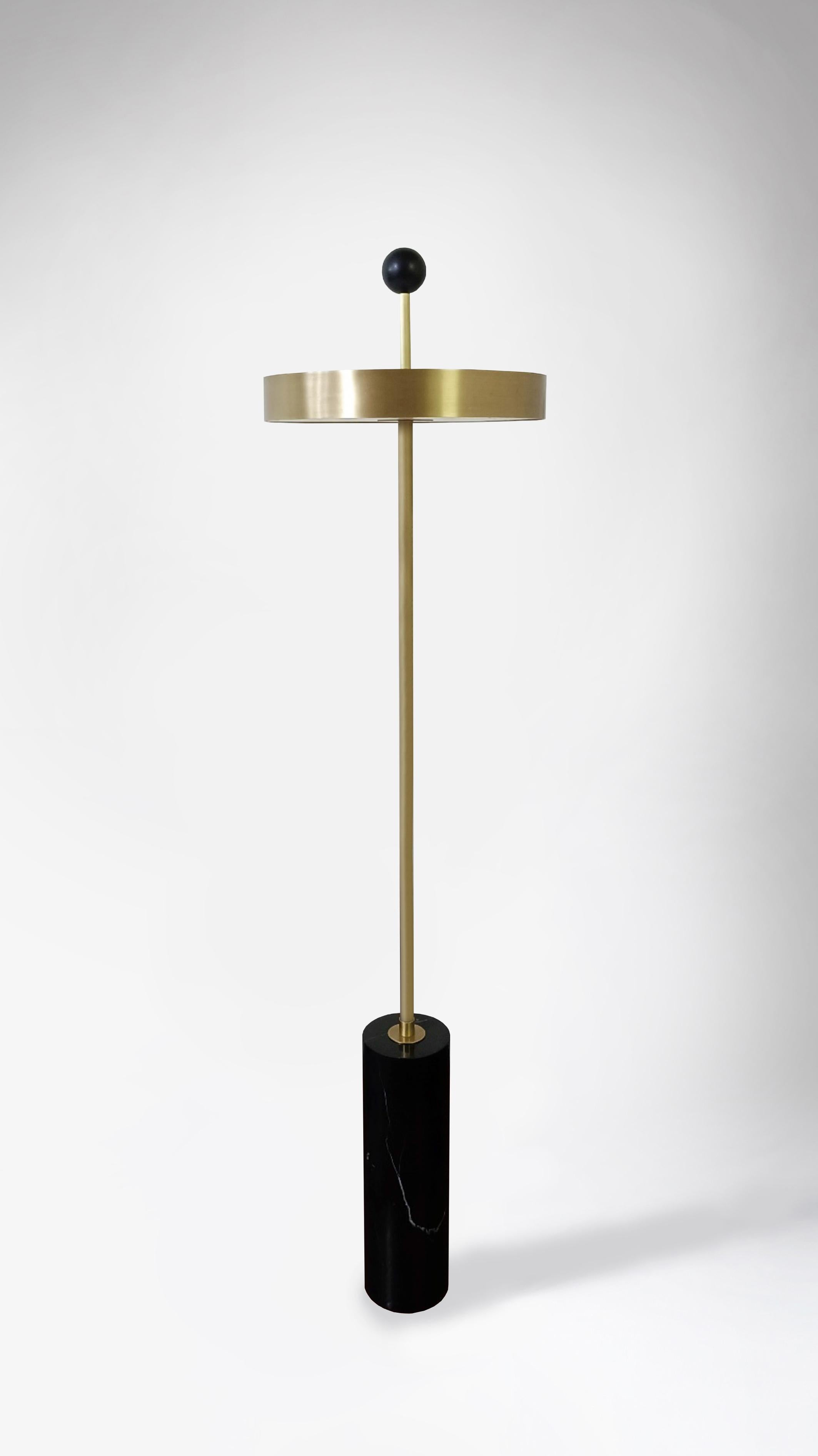 Disc and ball floor lamp by square in circle
Dimensions: H 165 x W 40 cm
Materials: Brushed brass finish, Black marble, powder coated black, opaque white acrylic diffuser

A statement floor lamp with a disc-shaped shade, allowing the light to