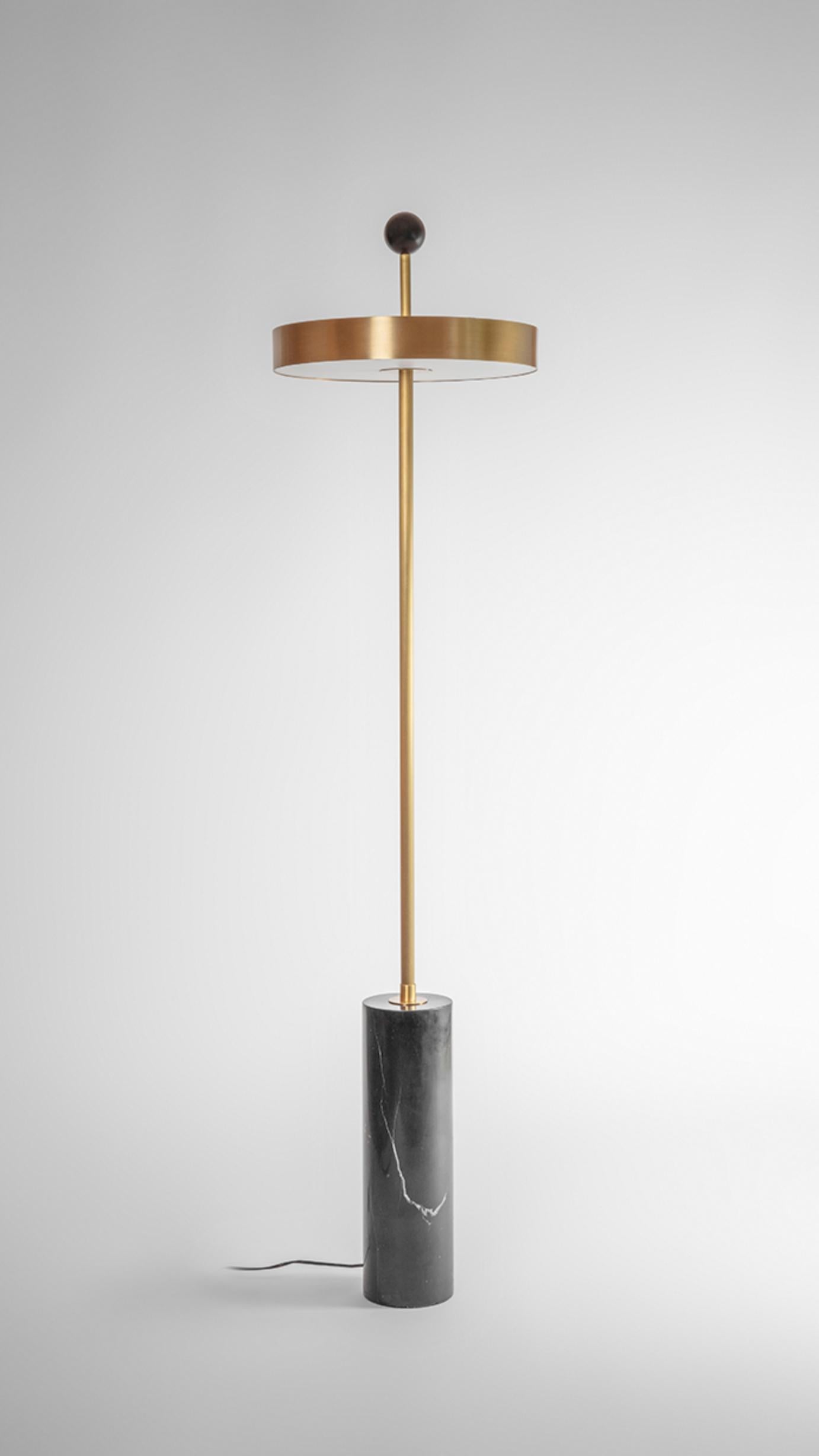 Disc and ball floor lamp by square in circle
Dimensions: H 165 x W 40 cm
Materials: brushed brass finish, black marble, powder coated black, opaque white acrylic diffuser

A statement floor lamp with a disc-shaped shade, allowing the light to