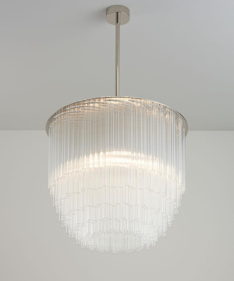 A true centerpiece and the perfect focal point for your space, the Disc Chandelier is one of our most popular designs. The clear borosilicate glass comes in a standard configuration and is extremely durable. The light has a made-to-measure stem and