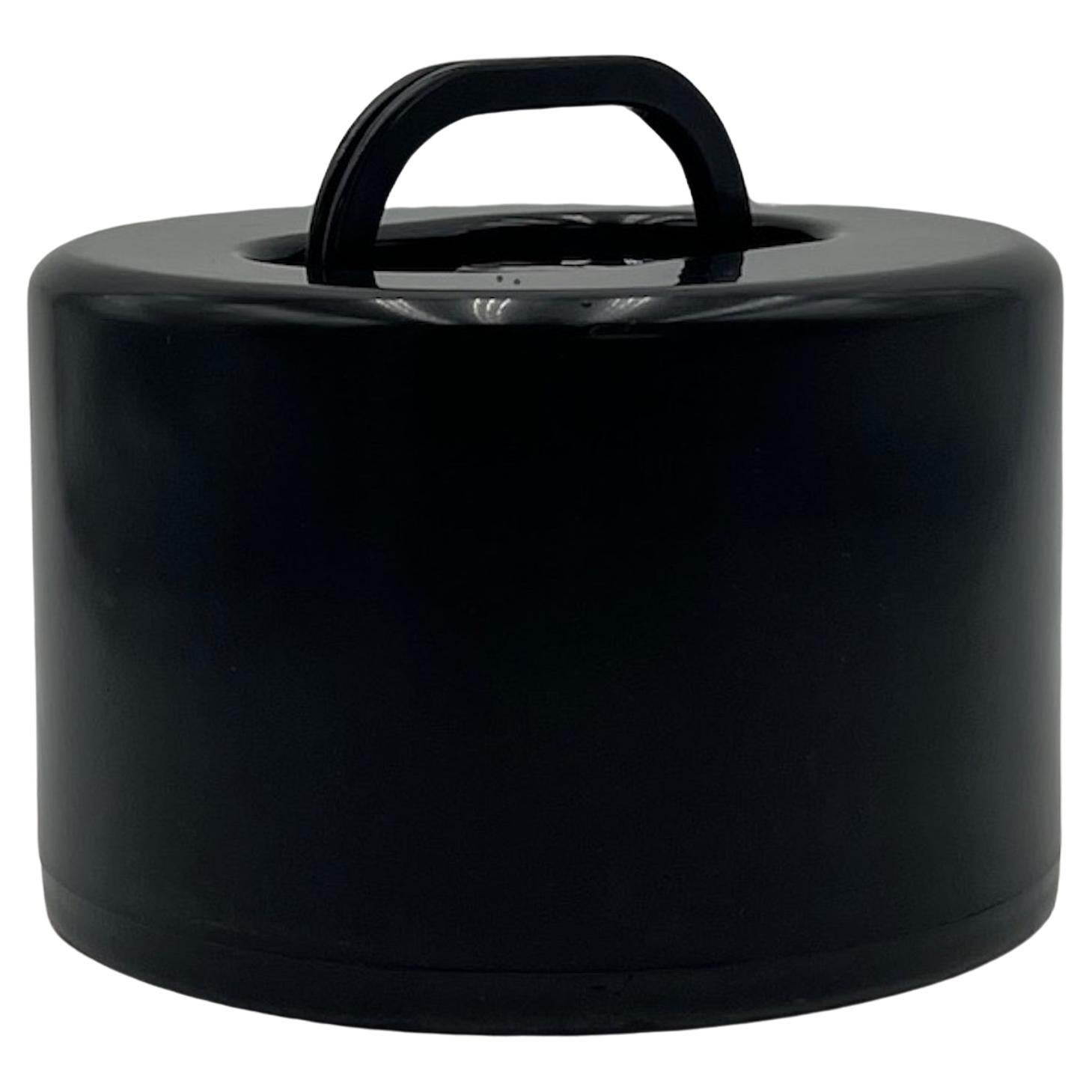 Lovely and rare plastic disc holder designed by Olaf Von Bohr and produced by Kartell.

This rare vintage piece is made of high density plastic. The black color is the perfect match for the 45 RPM discs that can be stored in this container. The