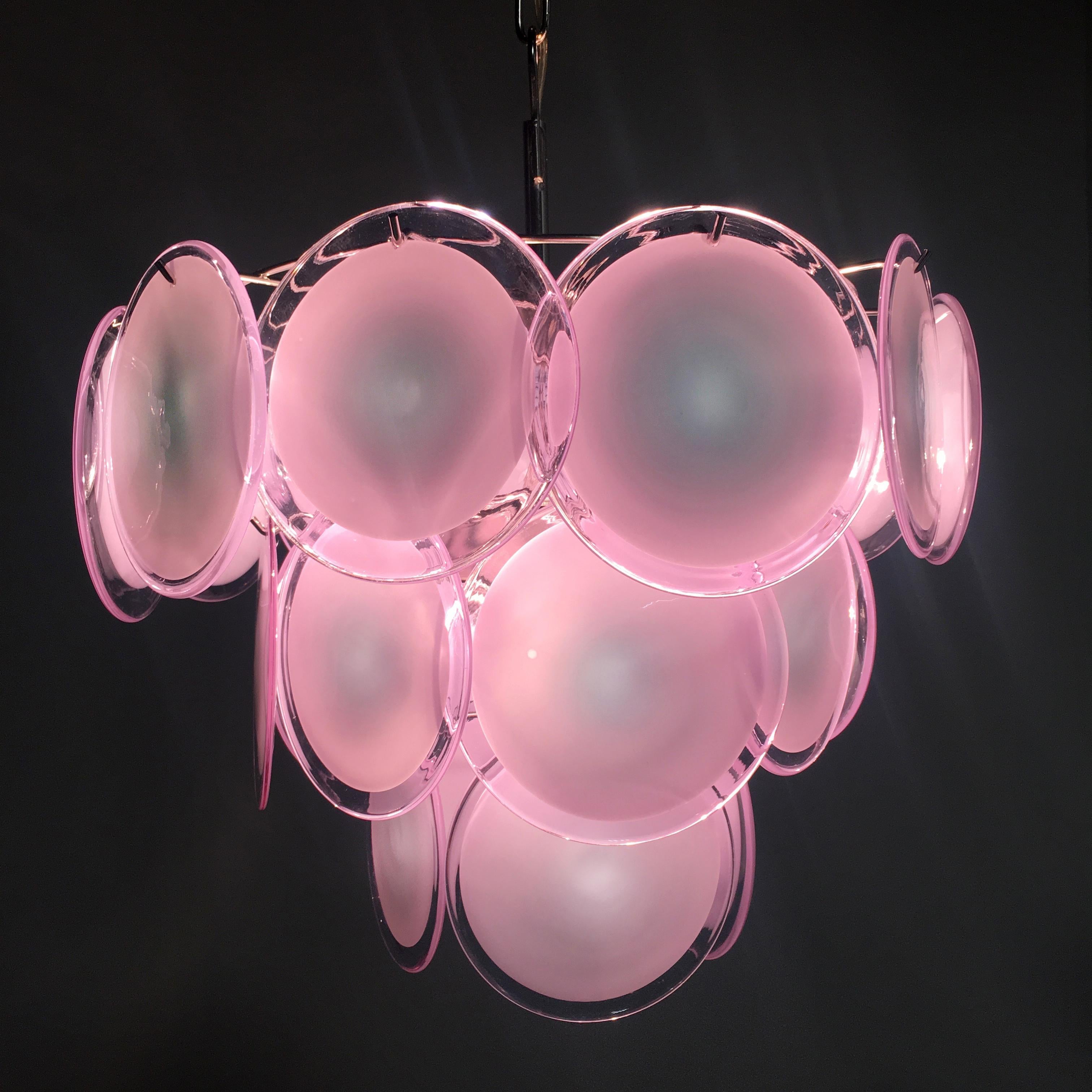 Vistosi midcentury pink discs Murano glass Italian chandelier.

Spectacular pair chandelier by Vistosi made in Murano formed by 23 pink discs of precious Murano glass are arranged on floor levels. Nine lights. Measures: Height without chain 50 cm.