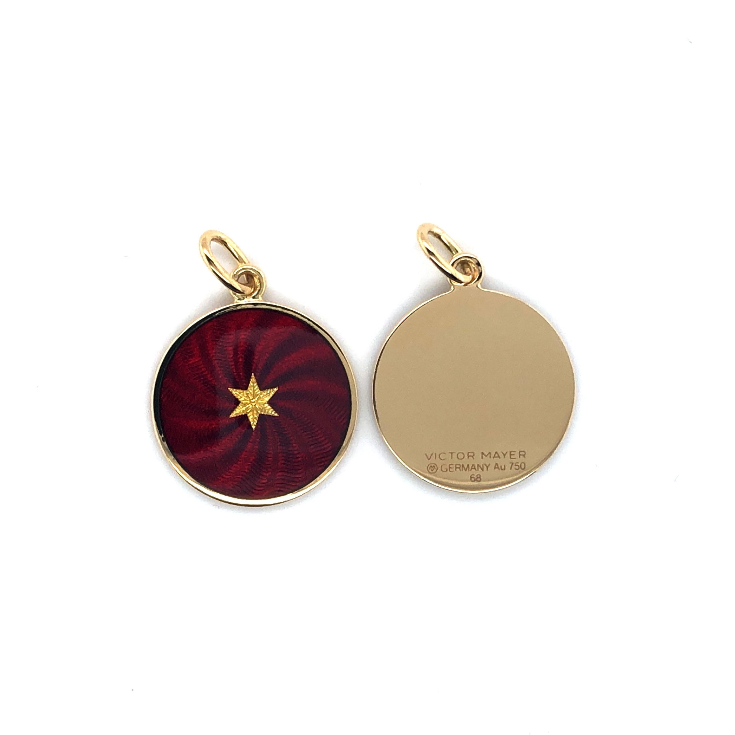 Victor Mayer disc pendant with star 18k yellow gold, Diskos collection, burgundy red vitreous enamel with star paillon, diameter app. 15.0 mm

About the creator Victor Mayer
Victor Mayer is internationally renowned for elegant timeless designs and
