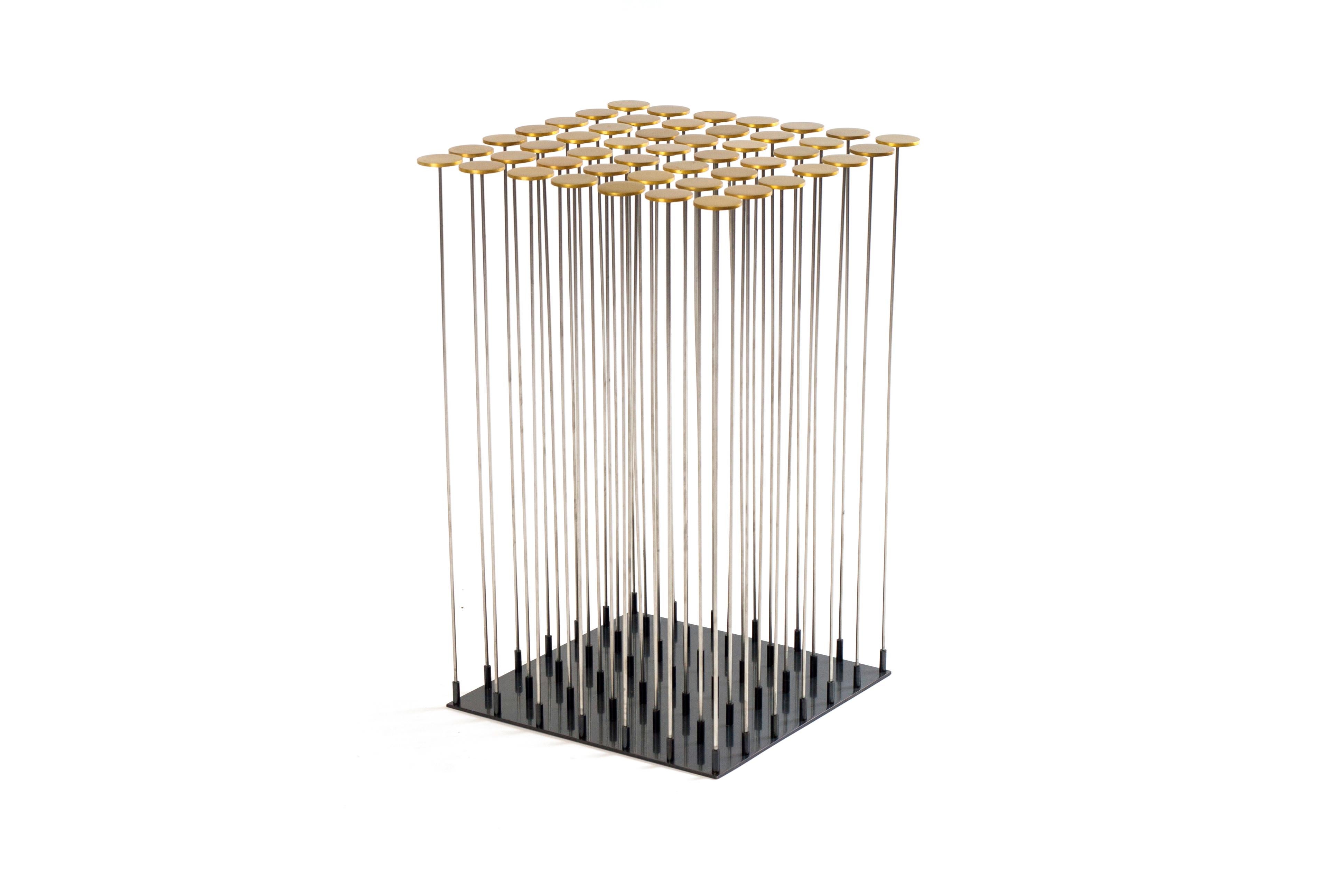 Dischi side table by Gentner Design.
Dimensions: D 30.5 x W 30.5 x H 48 cm.
Materials: brass, darkened stainless steel.

With a nod to Harry Bertoia, the Dischi table is both sculptural as it is functional. Amazingly stable as a table surface,