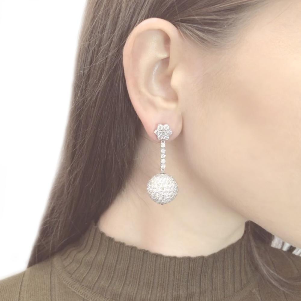 Handcrafted playful and stylish disco ball design dangling platinum earrings.
Adorned with round cut diamonds 18.34 ct in total. 
Diamonds are all natural and white in G-H Color Clarity VS.   
Platinum 950. 
Butterfly studs. 
Length: 4.7