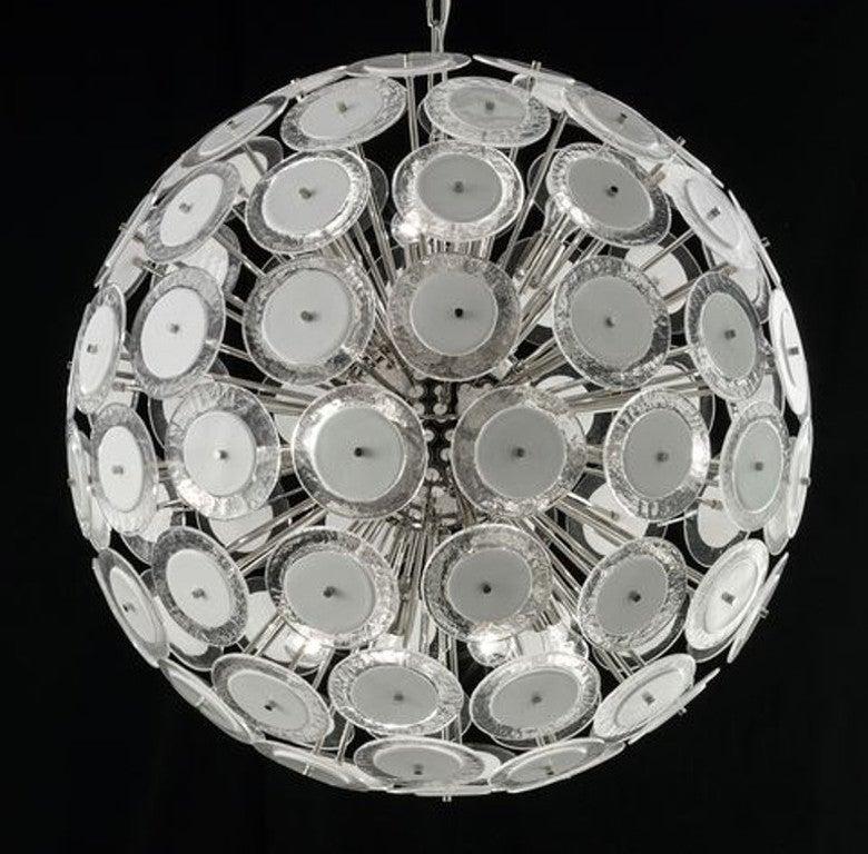 Italian round sputnik chandelier with white and clear Murano glass discs mounted on nickel finish metal frame by Fabio Ltd / Made in Italy
12 lights / E26 or E27 type / max 60W each
Measures: Diameter 37.5 inches, height 37.5 inches plus chain and