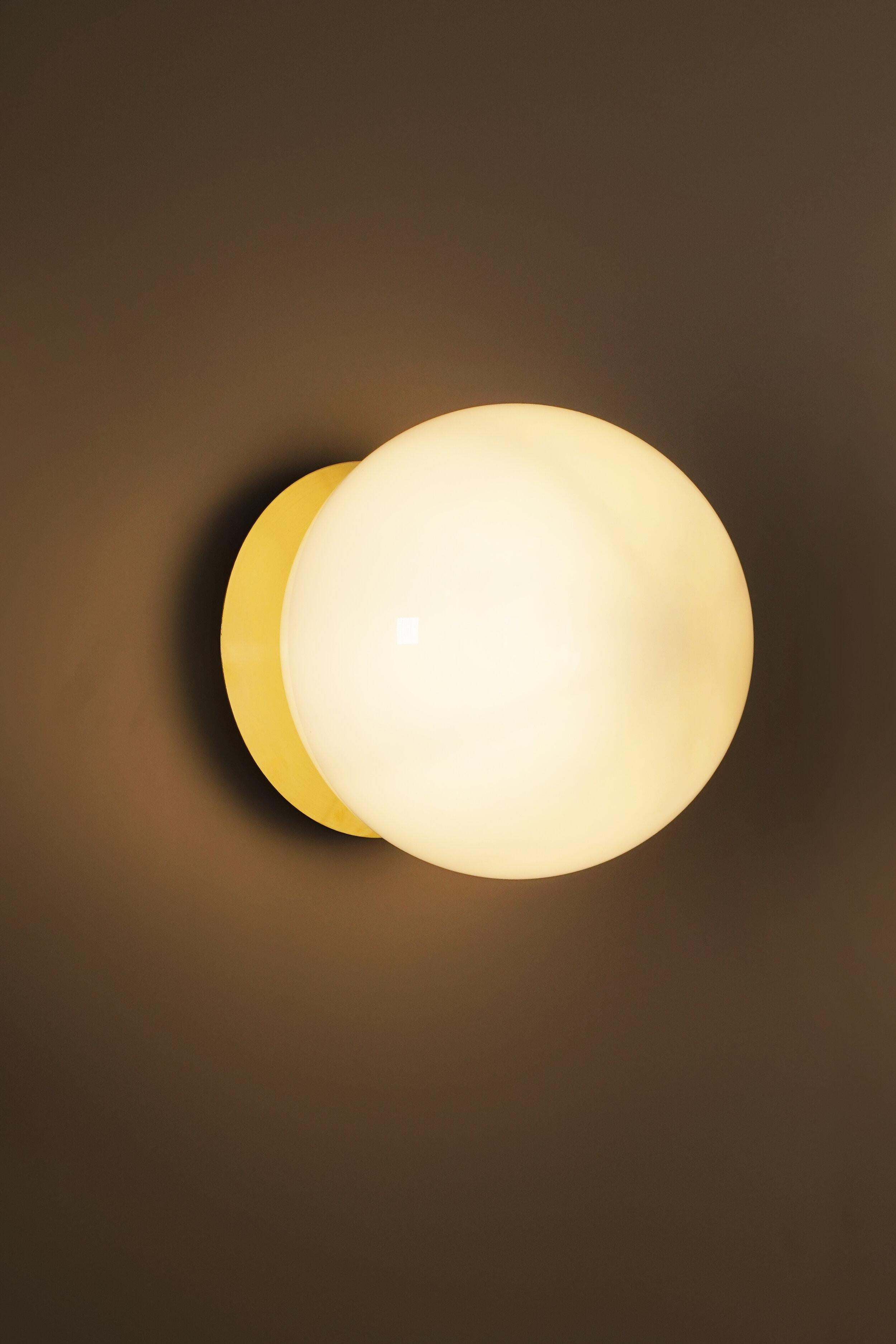 Disco wall light by Contain
Dimensions: D 20 x H 21.5 cm 
Materials: Brass structure and opal glass.
Available in different finishes. 

All our lamps can be wired according to each country. If sold to the USA it will be wired for the USA for
