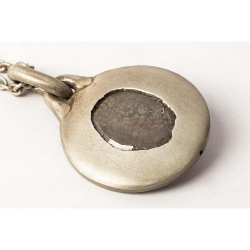 Disk necklace in acid treated sterling silver and a slab of rough diamond. This slab is removed from a larger chunk of diamond, it comes on a 74cm chain. This item is made with a naturally occurring element and will vary from the photograph you see.