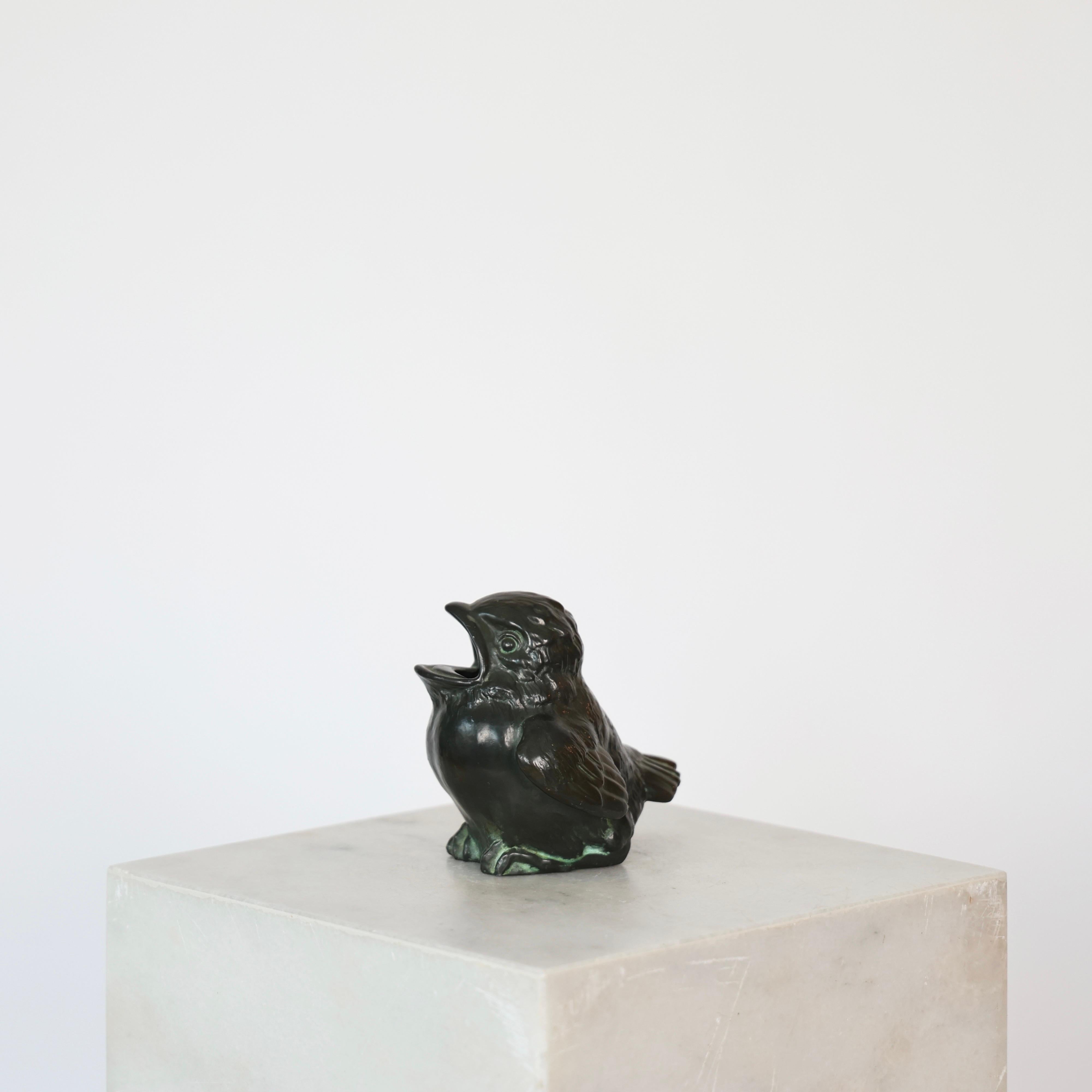 Diskometal Birds realizzato da Just Andersen all'inizio degli anni Quaranta. 

* Uccello in disco-metallo
* Designer: Just Andersen
* Model No: D2295 (timbro 