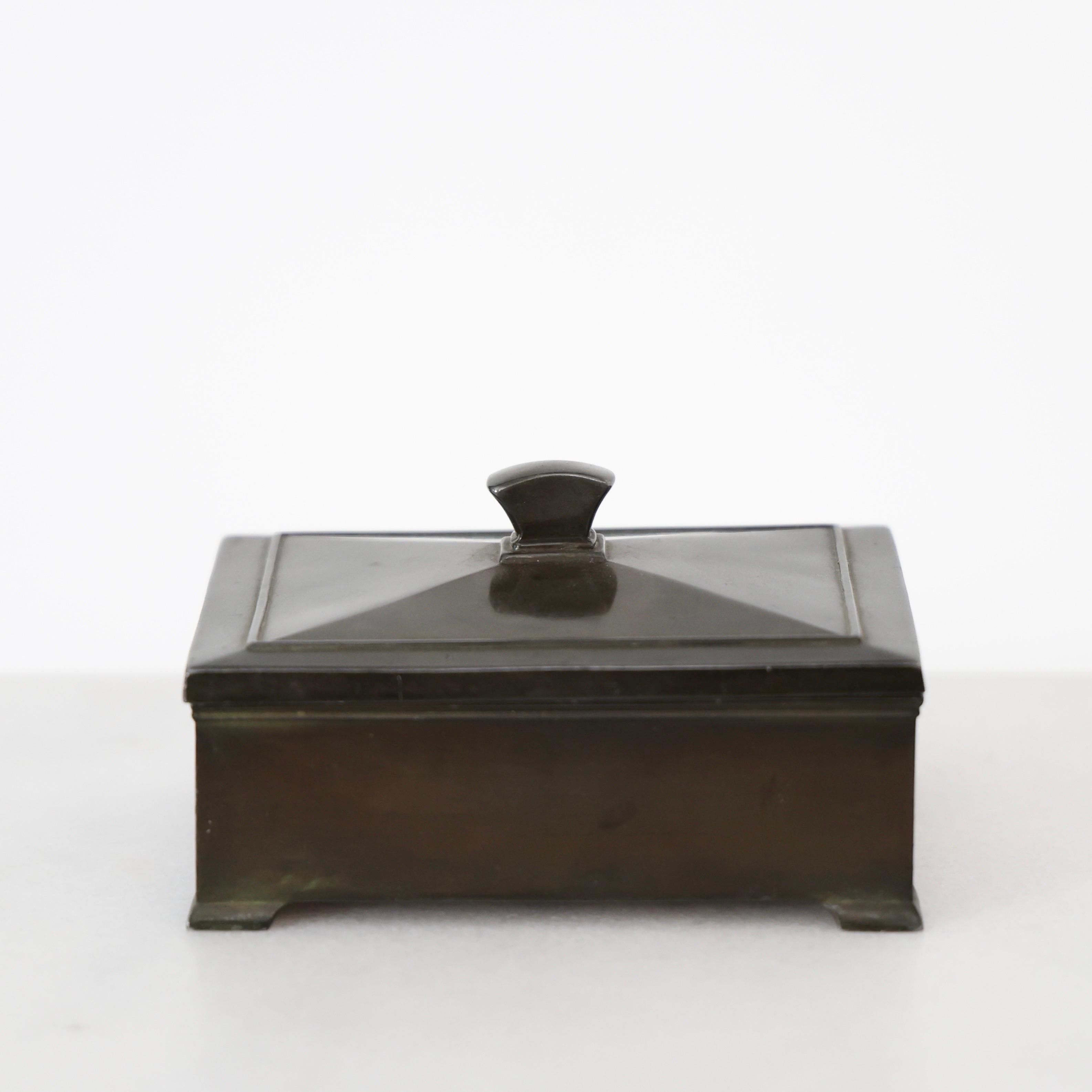 Diskometal Casket made by Just Andersen in the early 1930s. A fine piece for a beautiful spot. 

* Lidded diskometal casket / jewelry box with an inner wood box. 
* Designer: Just Andersen
* Style: 1441
Year: 1929-1933
* Condition: Good vintage