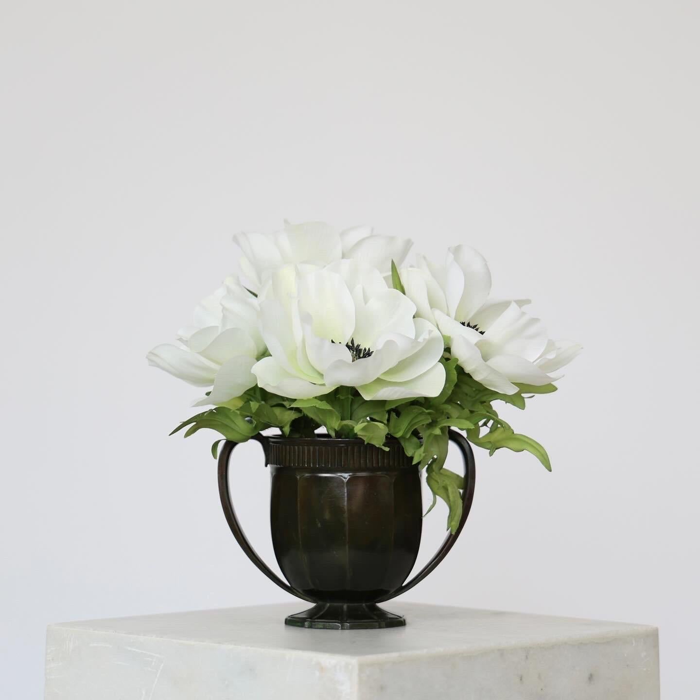 Delicate Diskometal Vase designed by Just Andersen in 1938.

* Round pedestal diskometal vase with lugs and chased vertical lines  
* Designer: Just Andersen
* Style: D2009
* Year: 1938
* Condition: Very good vintage condition. The diskometal is